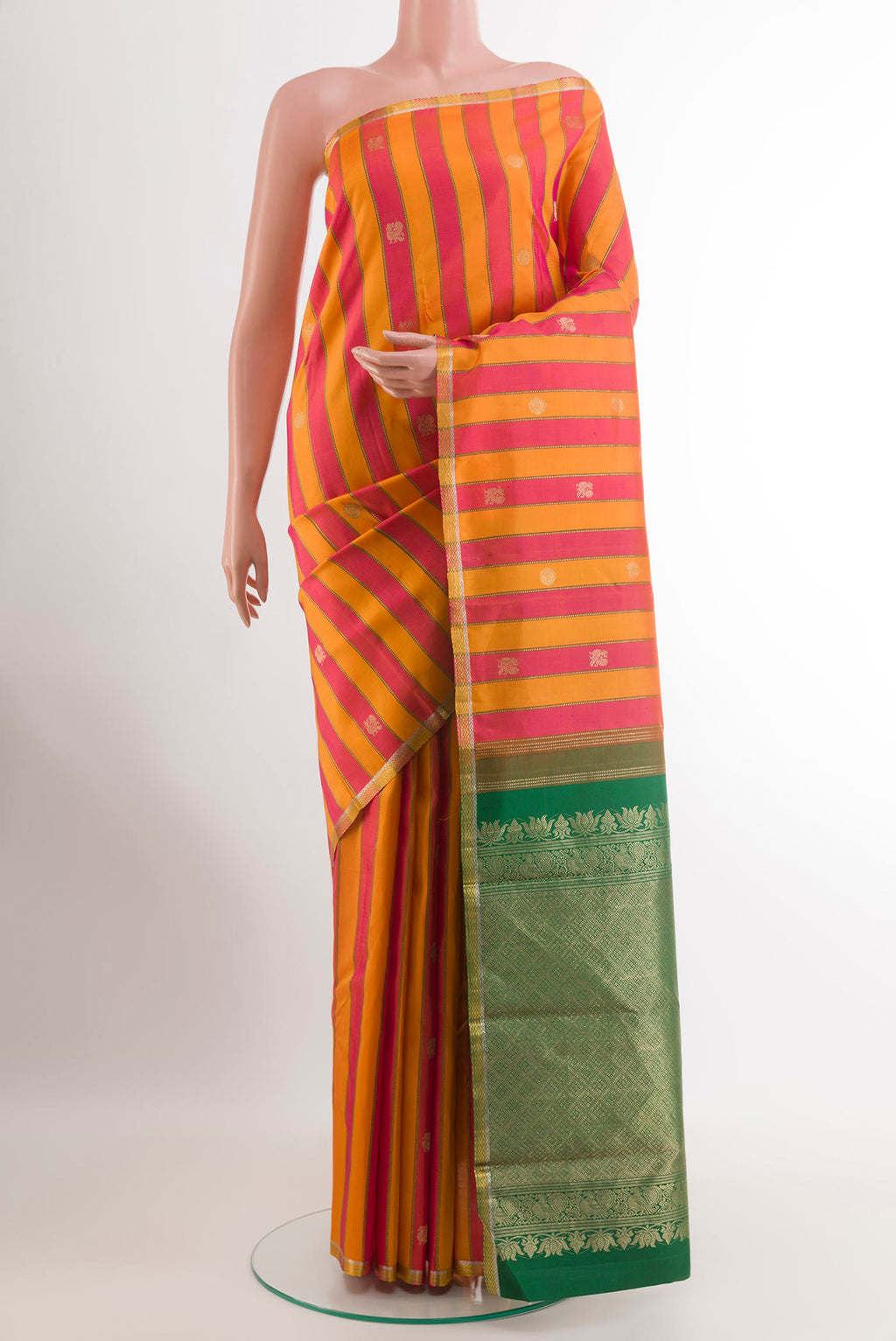 Orange Kanjivaram Silk Saree with Stripes on the body and Zari Border.  displayed on a mannequin