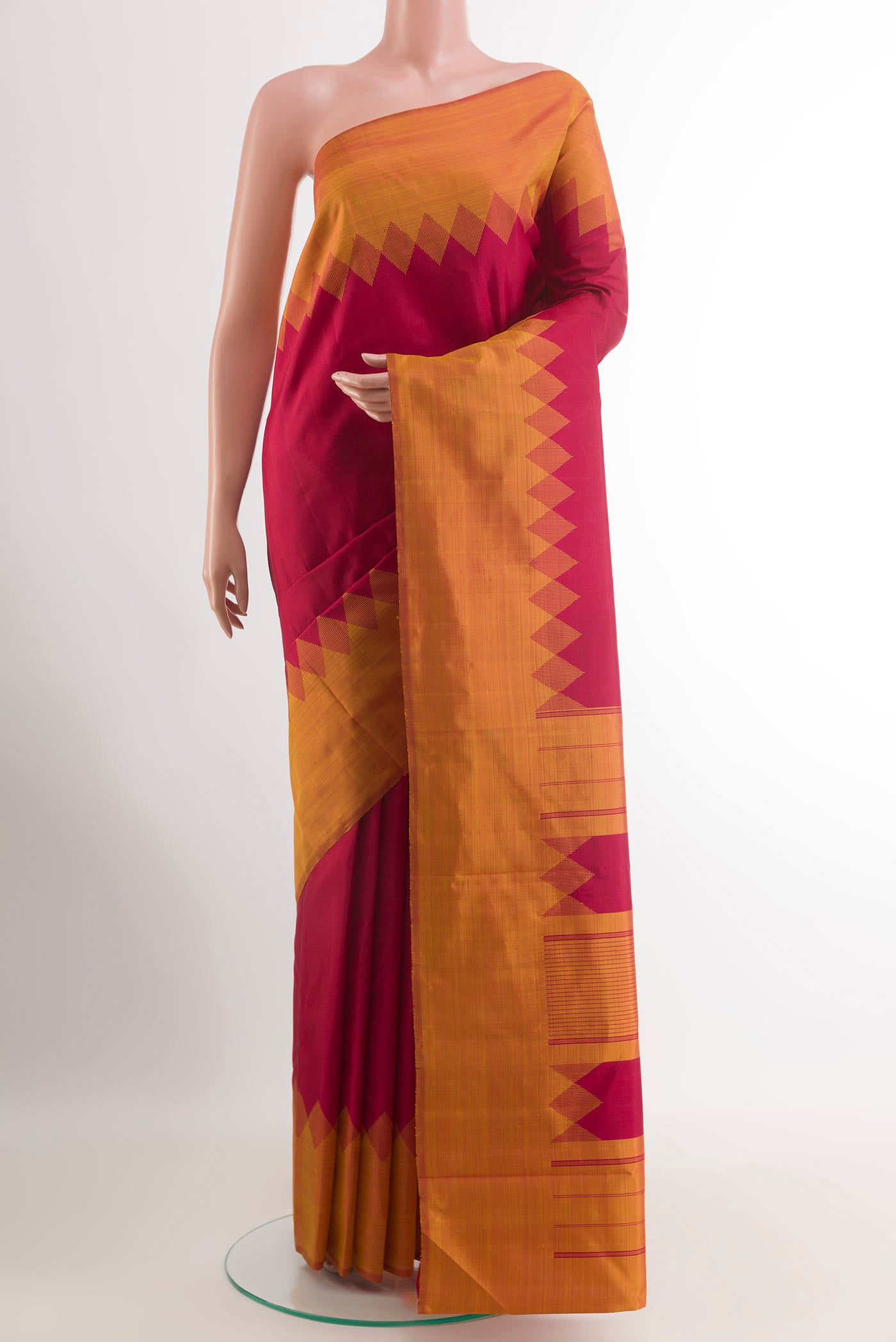 Red Kanjivaram Silk Saree with Zari Butta on the body and Zari Border.  displayed on a mannequin