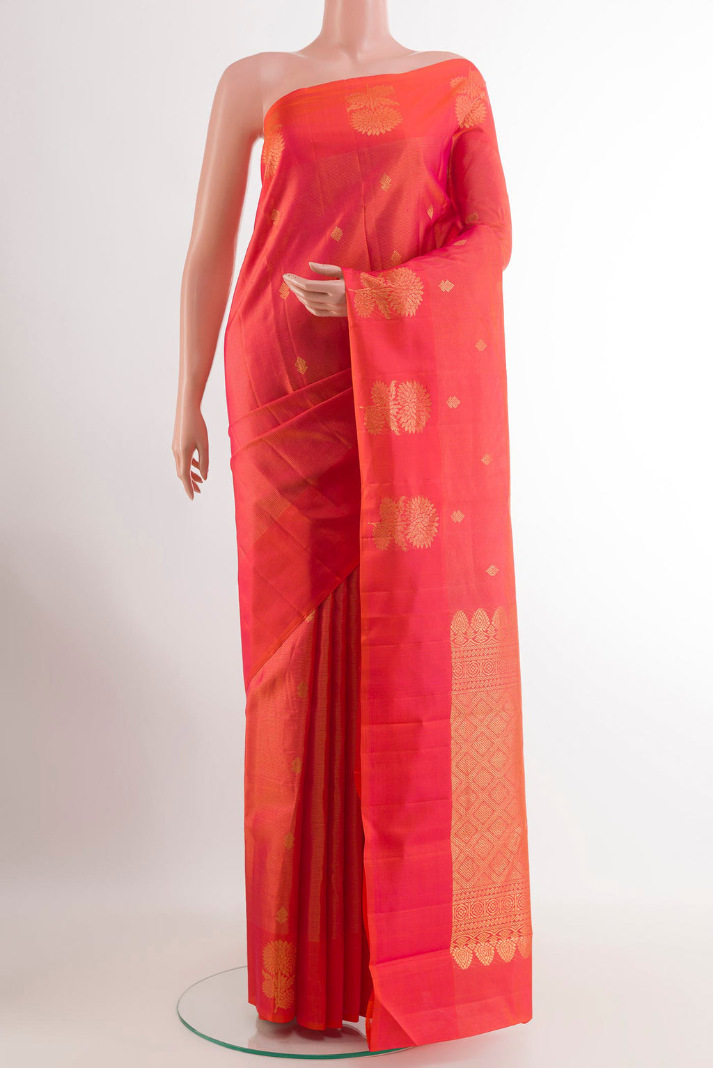 Pink Kanchipuram Silk Saree with Checked design on the body and Zari Border.  displayed on a mannequin