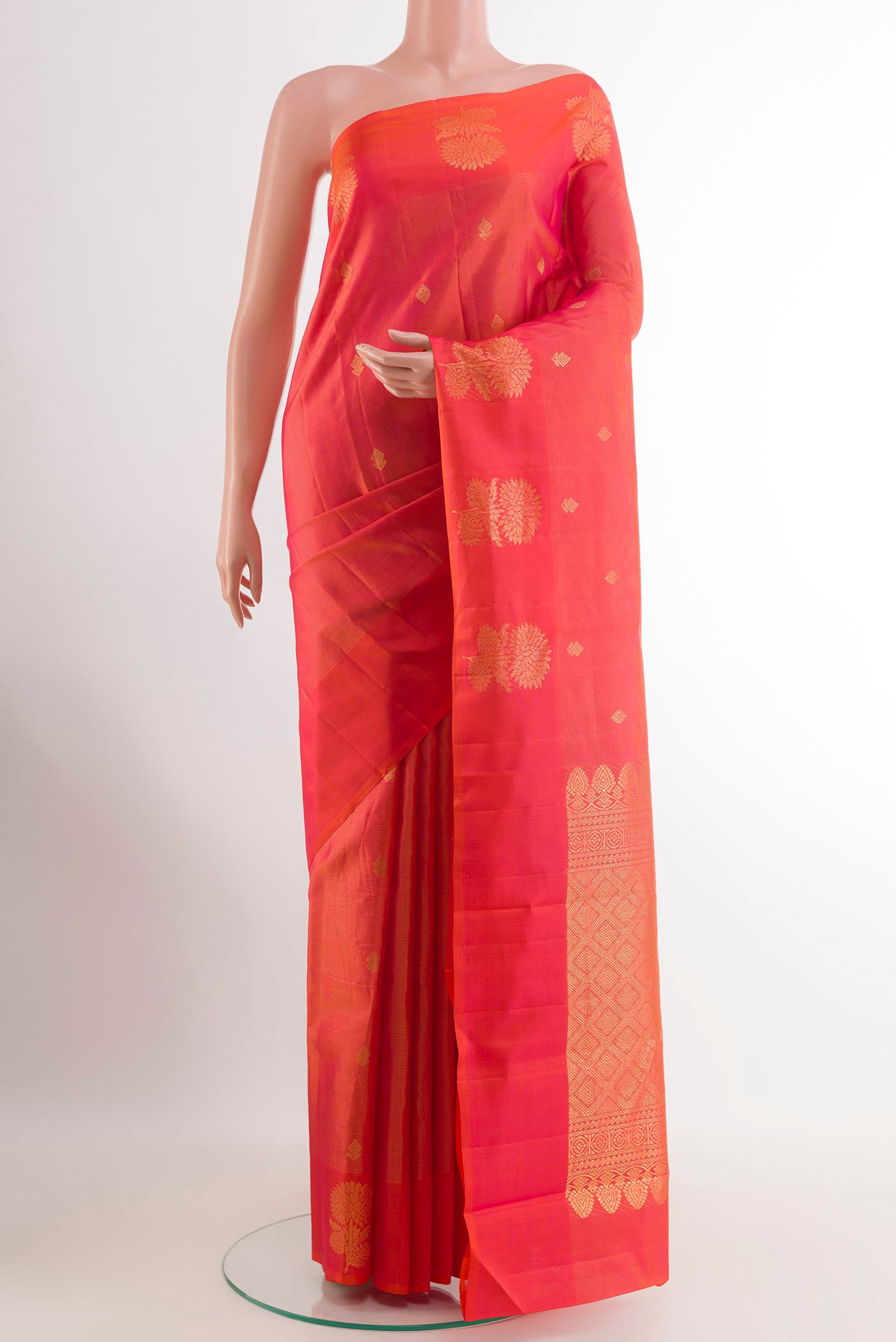 Pink Kanchipuram Silk Saree with Checked design on the body and Zari Border.  displayed on a mannequin