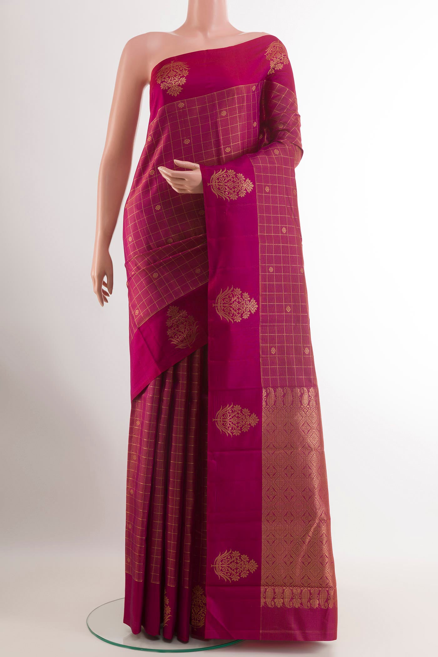 Purple Kanjivaram Silk Saree with Zari Brocade on the body and Zari Border.  displayed on a mannequin