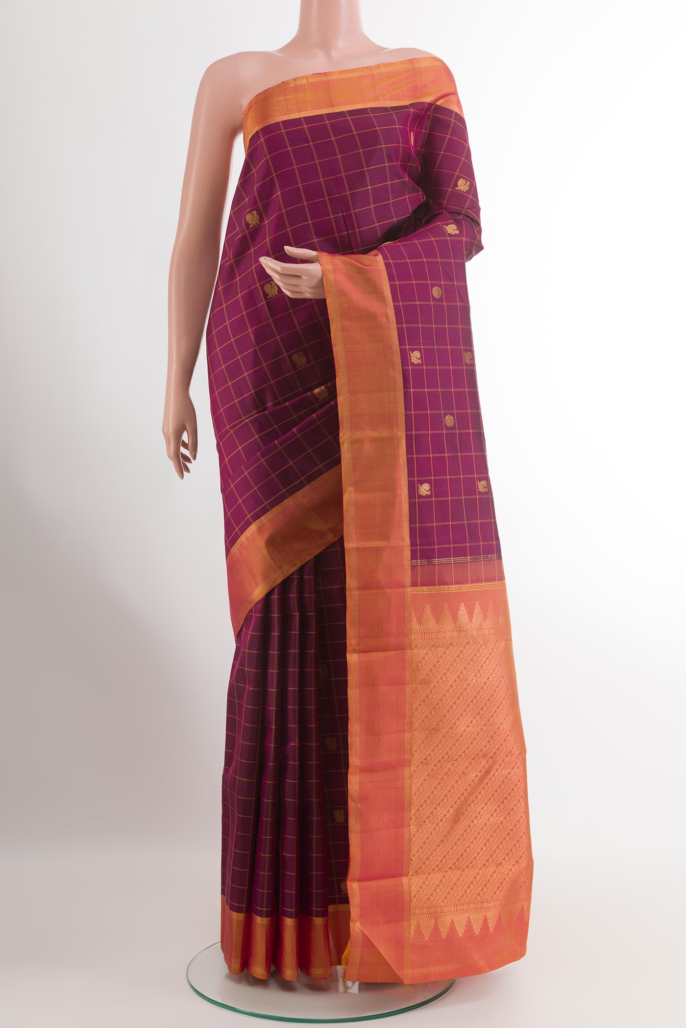 Purple Kanchipuram Silk Saree with Checked design on the body and Zari Border.  displayed on a mannequin