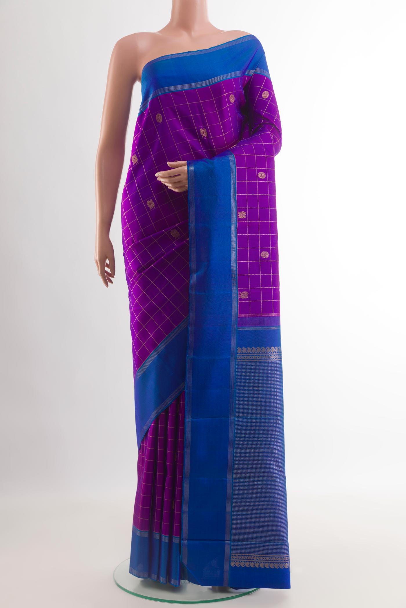 Purple Kanchipuram Silk Saree with Checked design on the body and Zari Border.  displayed on a mannequin