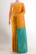 Yellow Kanchipuram Silk Saree with Zari Butta on the body and Zari Border.  displayed on a mannequin
