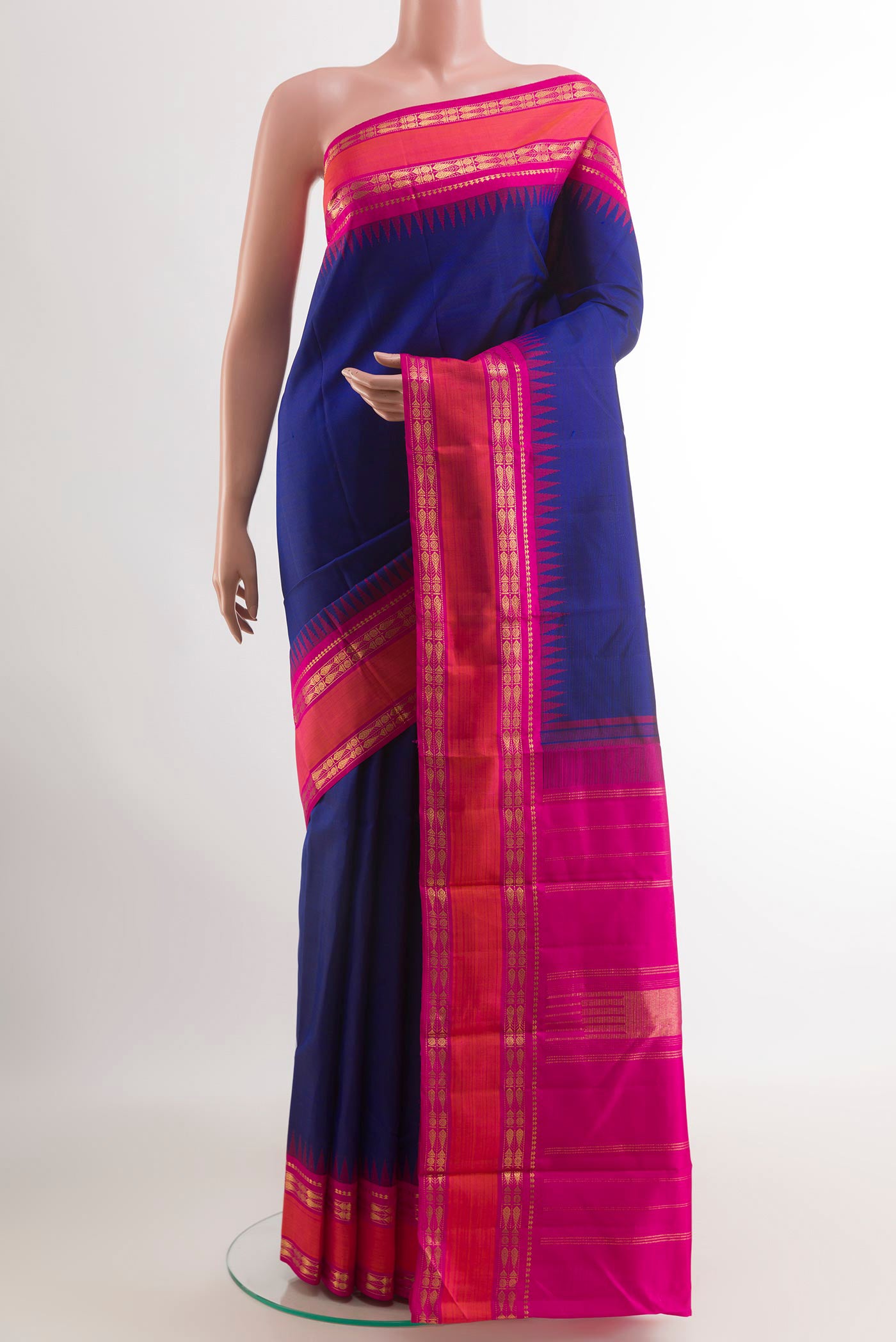 Blue Kanjivaram Silk Saree with Plain Body and Zari Border.  displayed on a mannequin
