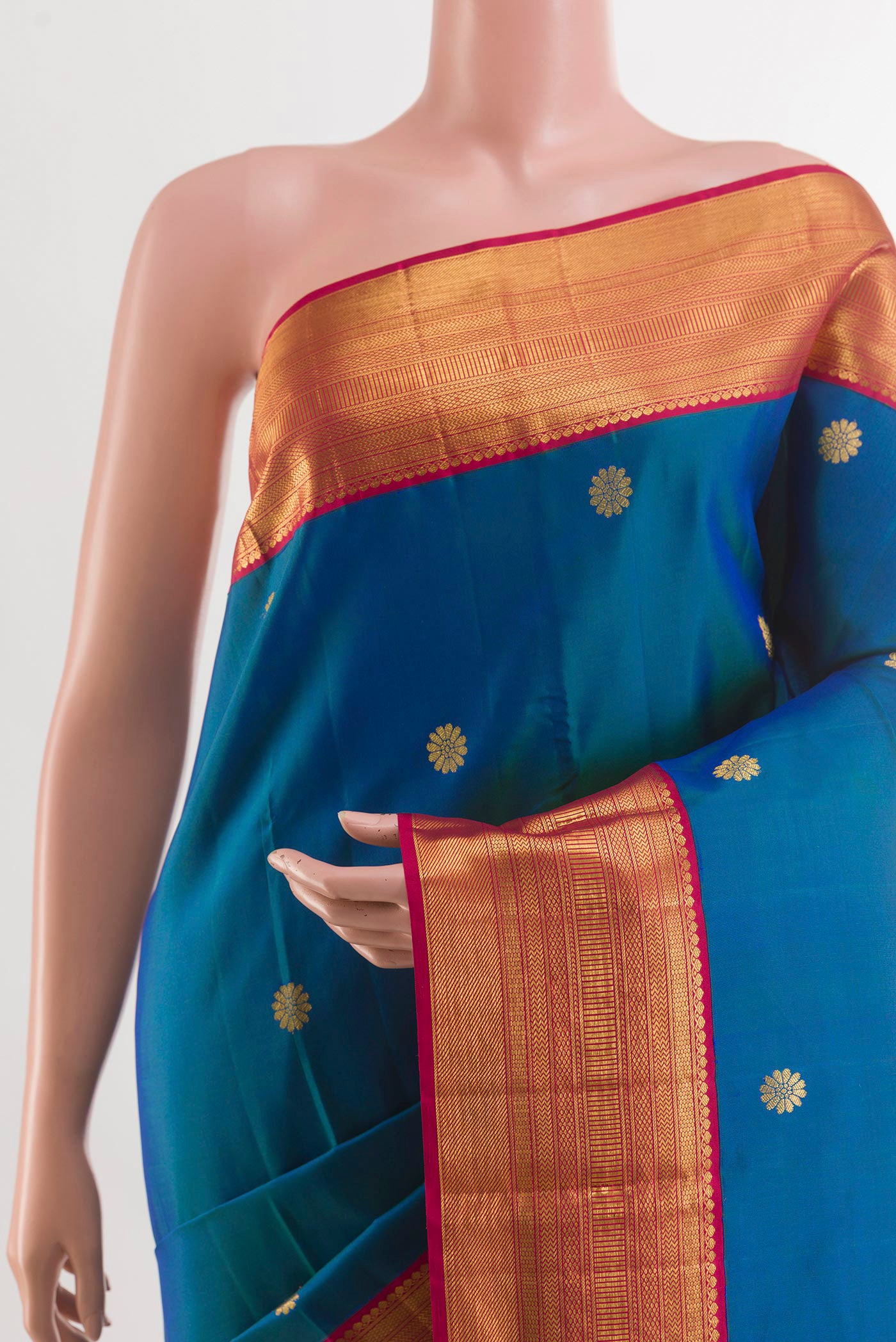 Border image of Peacock Blue Kanjivaram Silk Saree with Zari Butta on the body and Zari Border. 