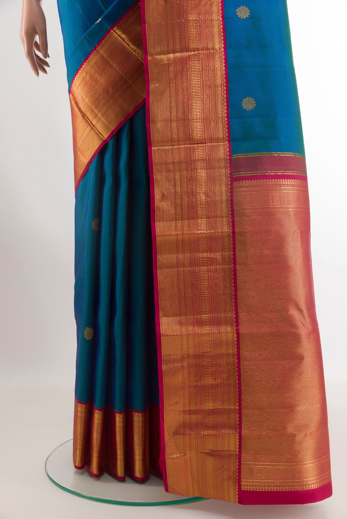 Pleats and pallu of Peacock Blue Kanjivaram Silk Saree with Zari Butta on the body and Zari Border. 