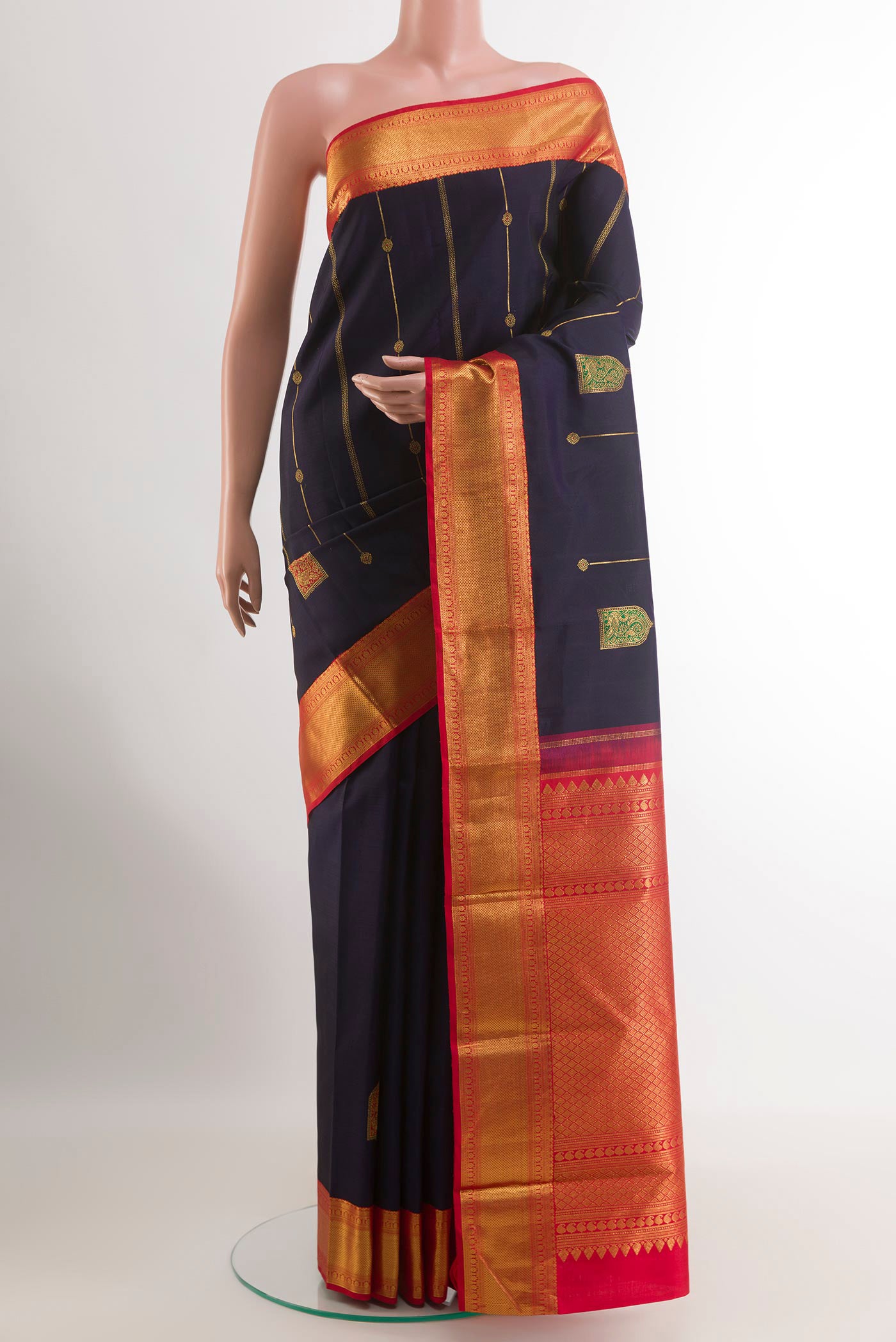 Blue Kanchipuram Silk Saree with Zari Butta on the body and Zari Border.  displayed on a mannequin