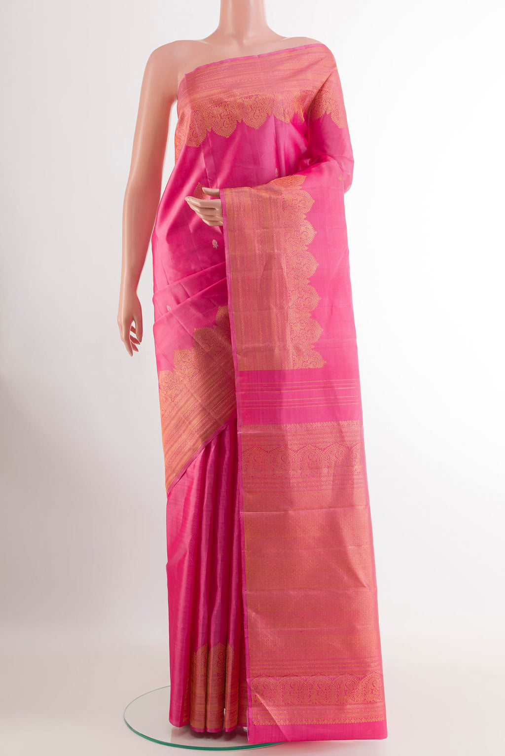 Pink Kanjivaram Silk Saree with Zari Butta on the body and Zari Border.  displayed on a mannequin