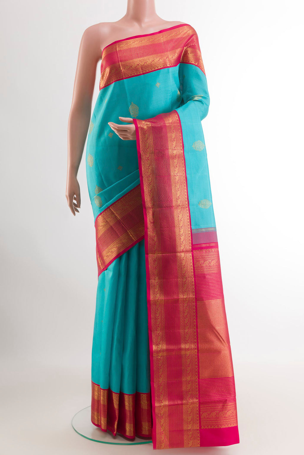 Blue Kanjivaram Silk Saree with Zari Butta on the body and Zari Border.  displayed on a mannequin