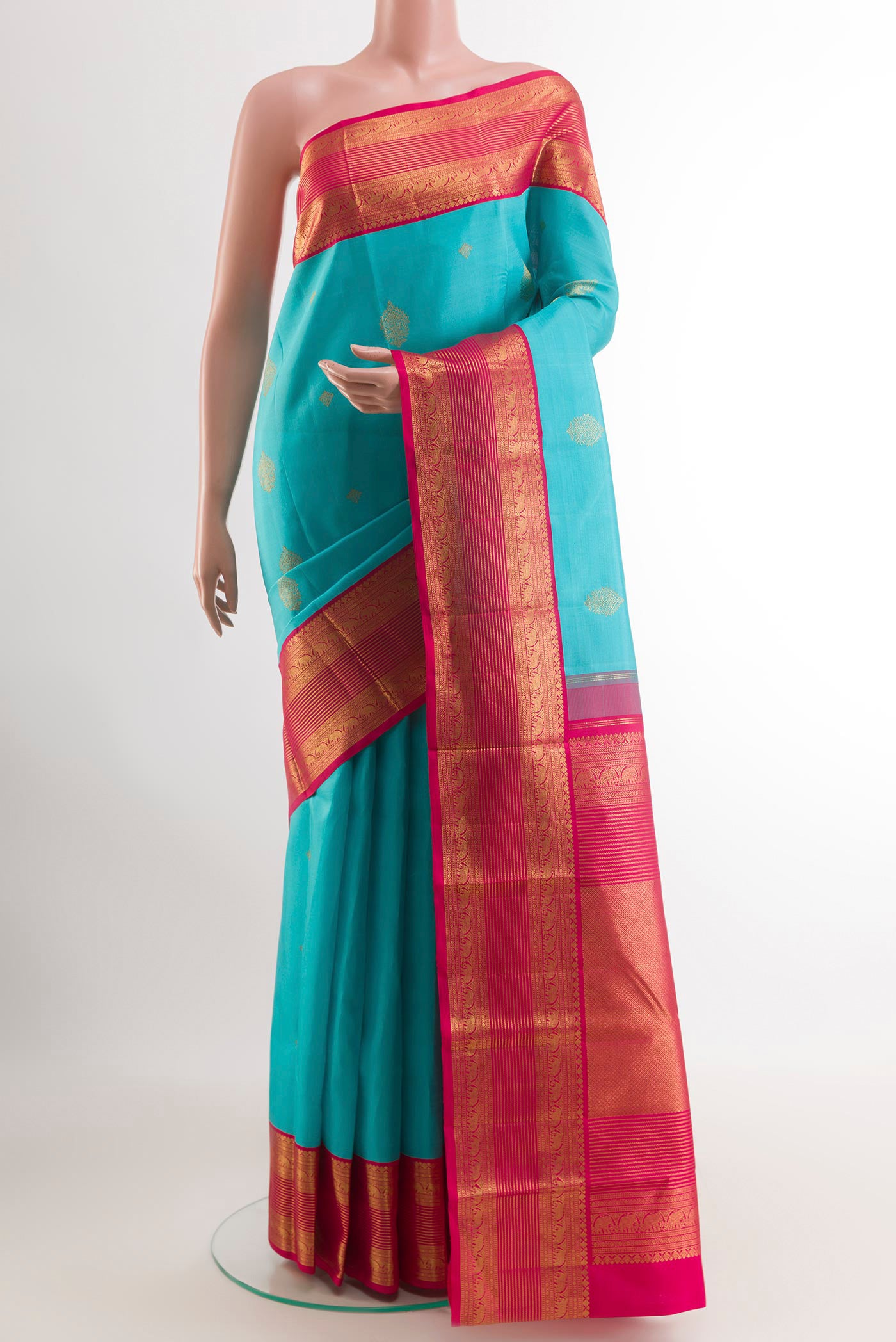 Blue Kanjivaram Silk Saree with Zari Butta on the body and Zari Border.  displayed on a mannequin