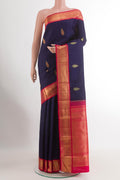 Blue Kanjivaram Silk Saree with Zari Butta on the body and Zari Border.  displayed on a mannequin