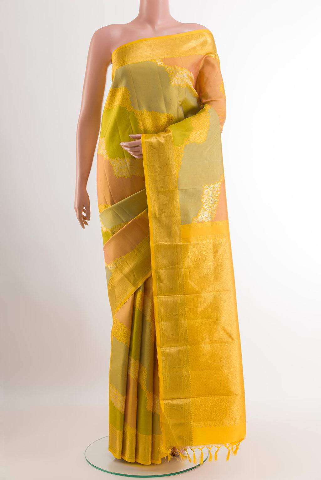 Yellow Kanchipuram Silk Saree with Zari Brocade on the body and Zari Border.  displayed on a mannequin
