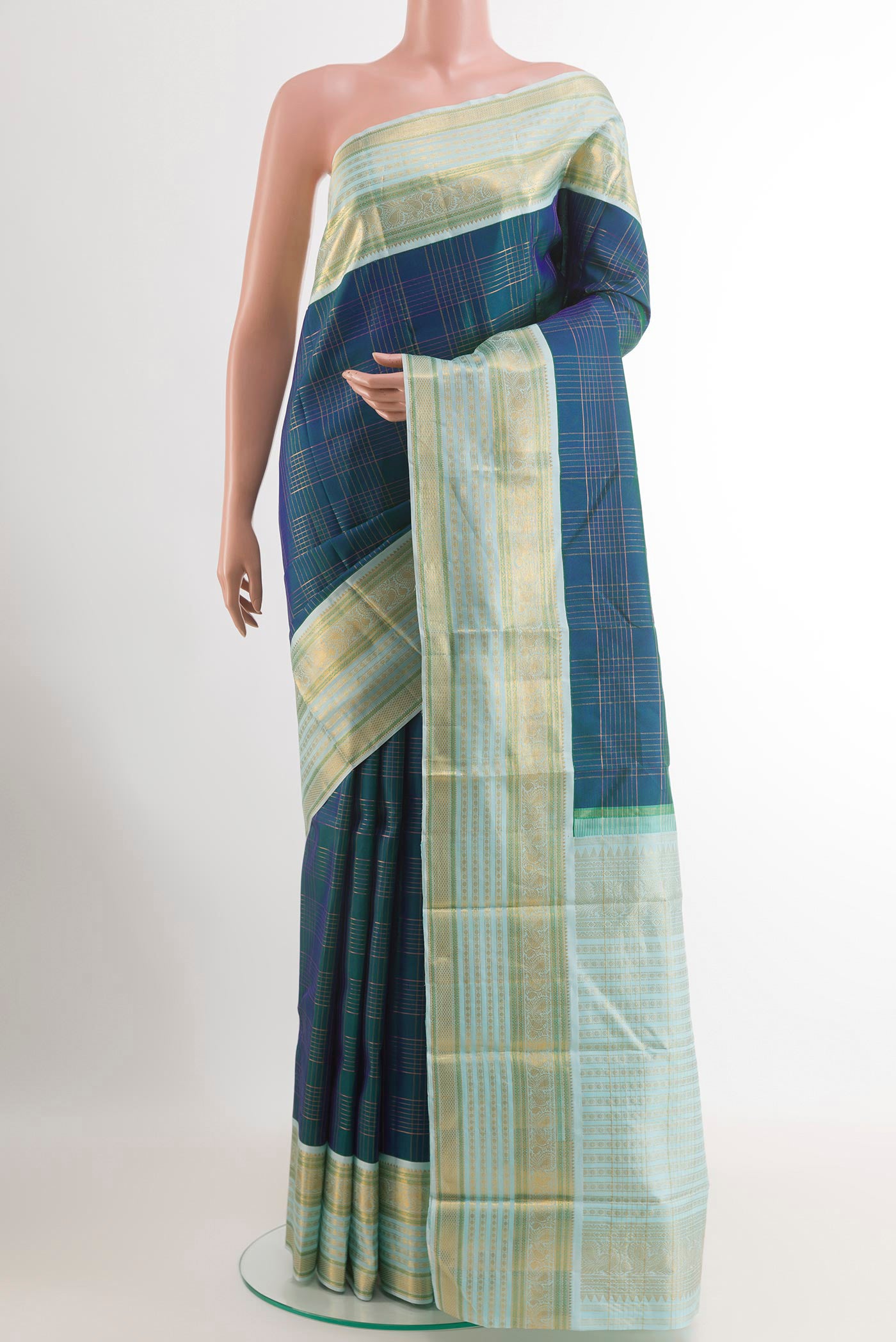 Peacock Blue Kanjivaram Silk Saree with Checked design on the body and Zari Border.  displayed on a mannequin
