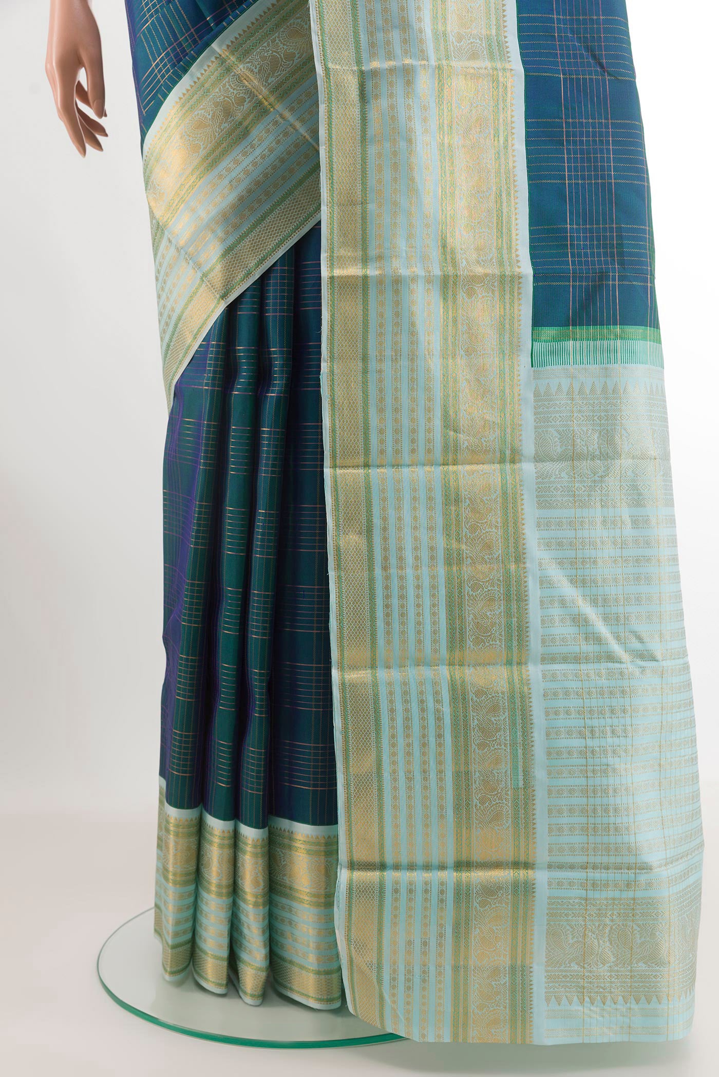 Pleats and pallu of Peacock Blue Kanjivaram Silk Saree with Checked design on the body and Zari Border. 