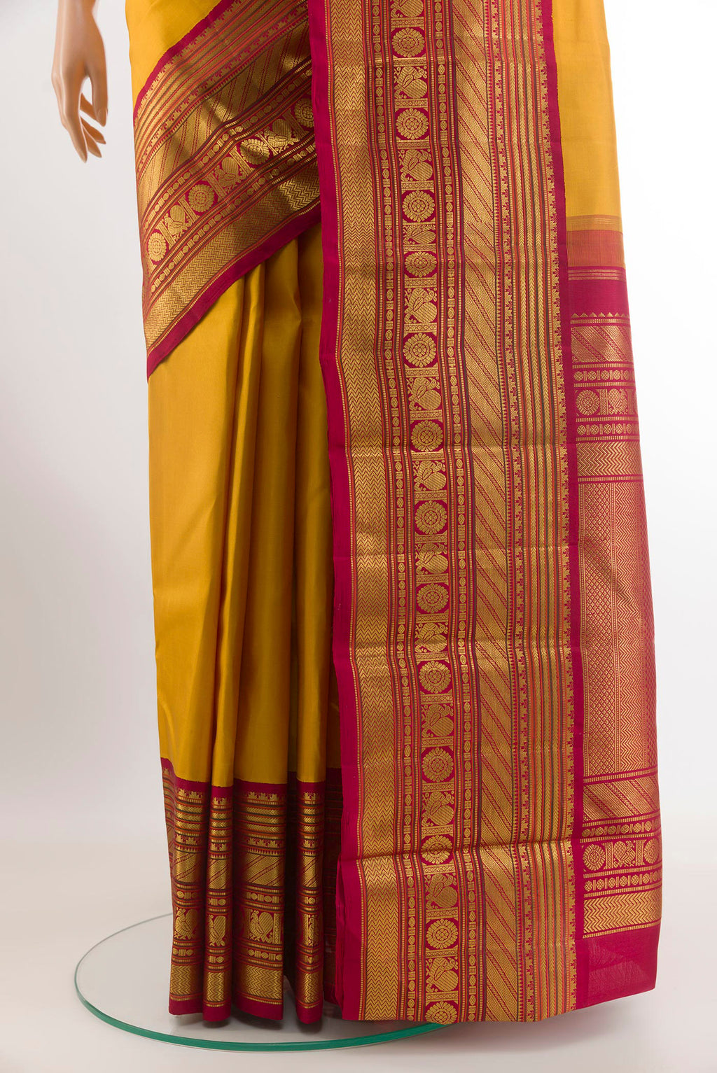 Pleats and pallu of Yellow Kanjivaram Silk Saree with Plain Body and Zari Border. 