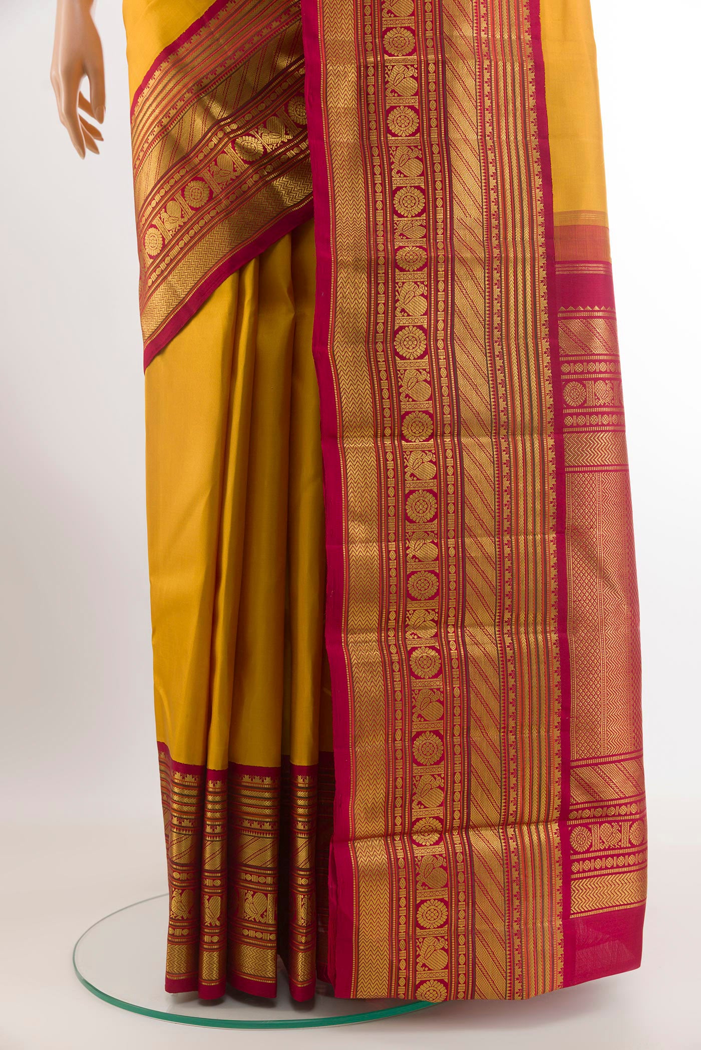 Pleats and pallu of Yellow Kanjivaram Silk Saree with Plain Body and Zari Border. 