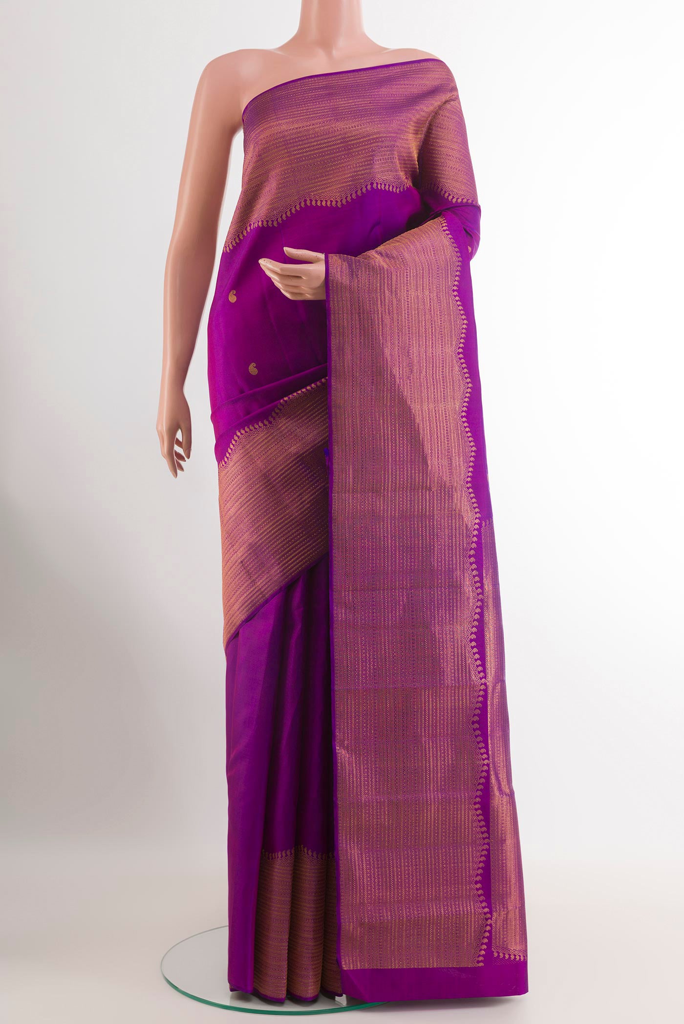 Purple Kanjivaram Silk Saree with Zari Butta on the body and Zari Border.  displayed on a mannequin