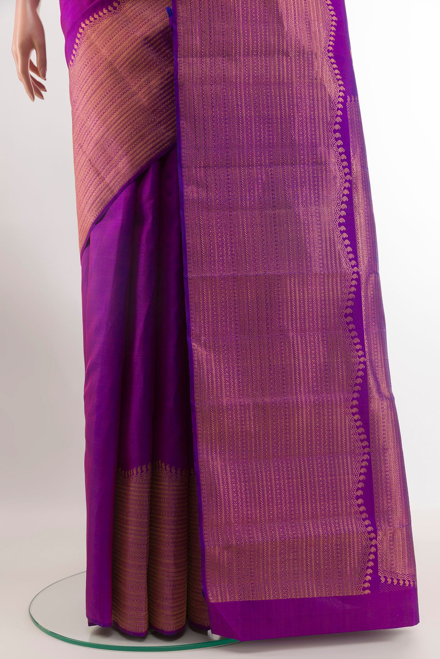 Pleats and pallu of Purple Kanjivaram Silk Saree with Zari Butta on the body and Zari Border. 