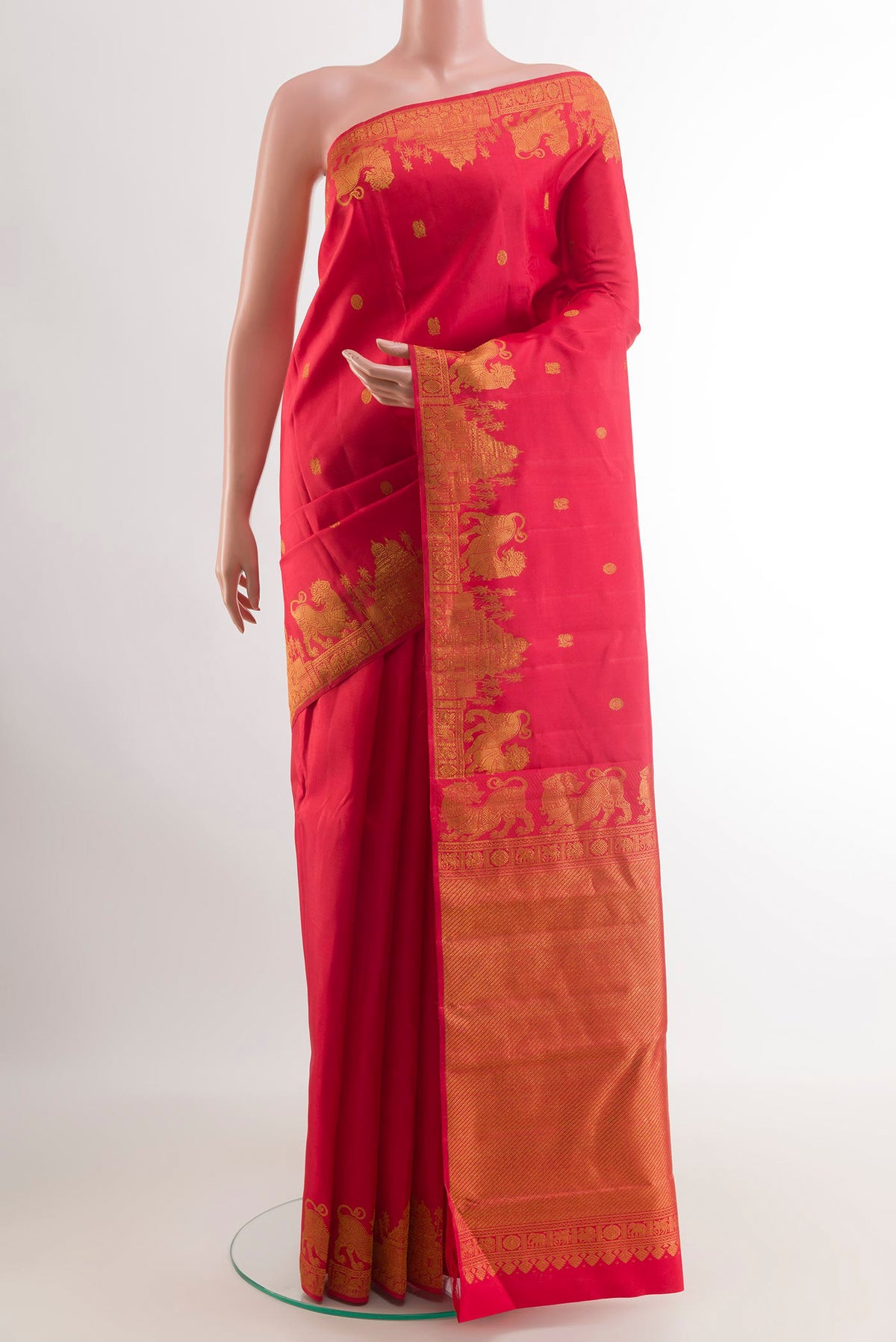 Red Kanjivaram Silk Saree with Zari Butta on the body and Zari Border.  displayed on a mannequin
