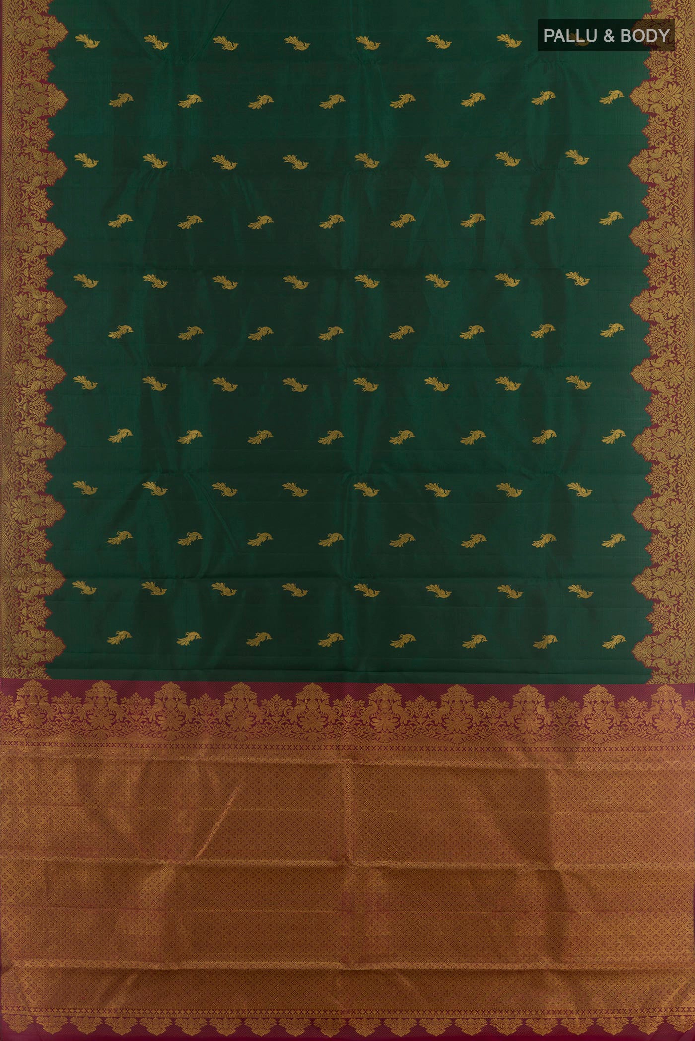 Flat view of Bottle Green Kanchipuram Silk Saree with Zari Butta on the body and Zari Border. 