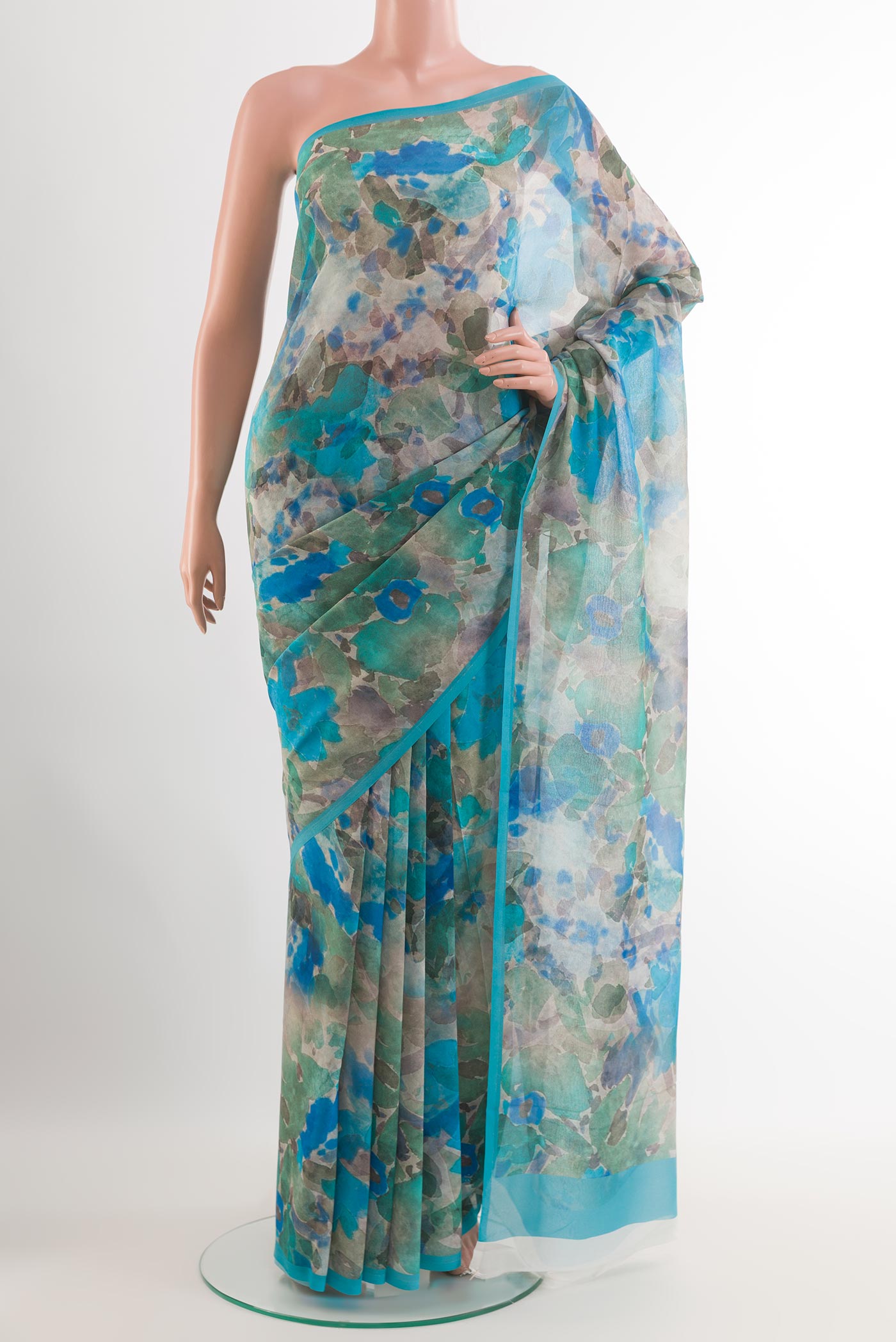 Blue Chiffon Saree with Printed design on the body and Plain Border.  displayed on a mannequin