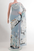 Blue Chiffon Saree with Printed design on the body and Plain Border.  displayed on a mannequin