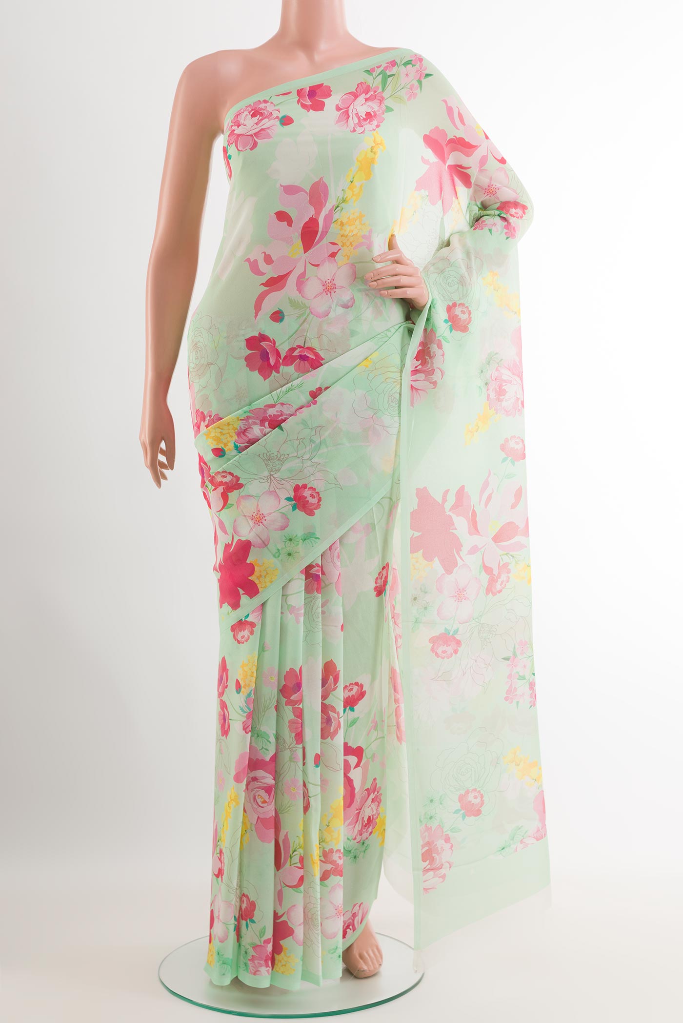Light Green Chiffon Saree with Printed design on the body and Plain Border.  displayed on a mannequin