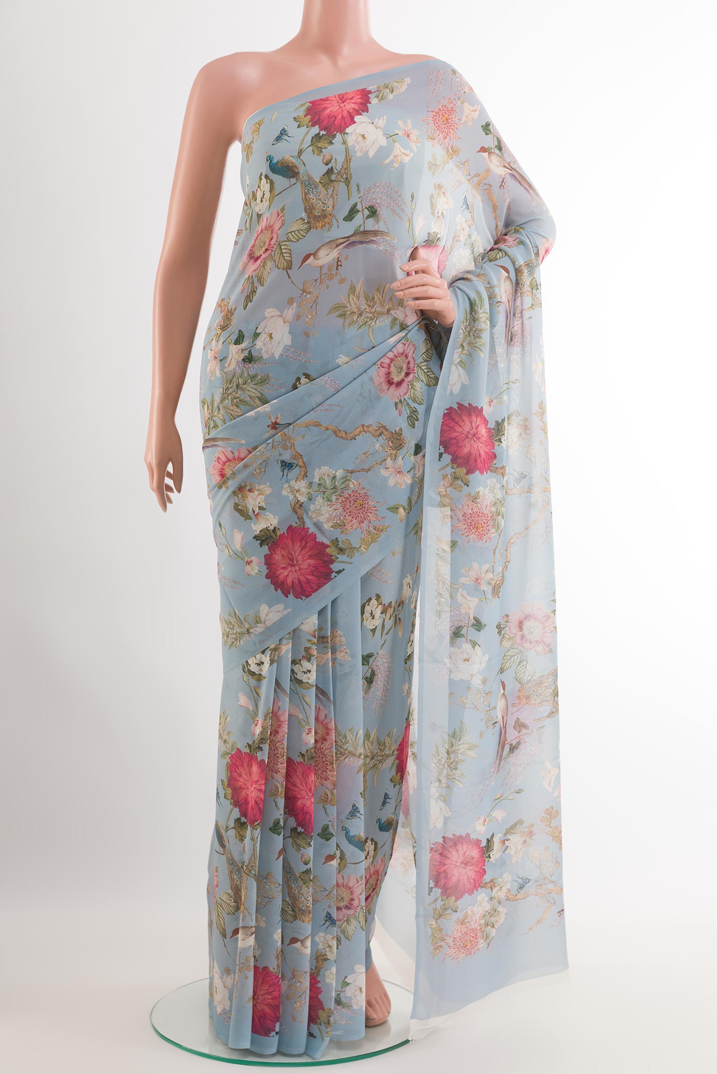 Blue Chiffon Saree with Printed design on the body and Plain Border.  displayed on a mannequin
