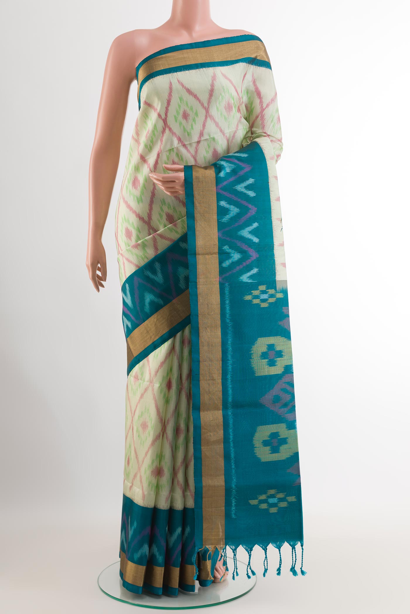 Mint Green Soft Silk Saree with Pure Ikat on the body and Zari Border.  displayed on a mannequin