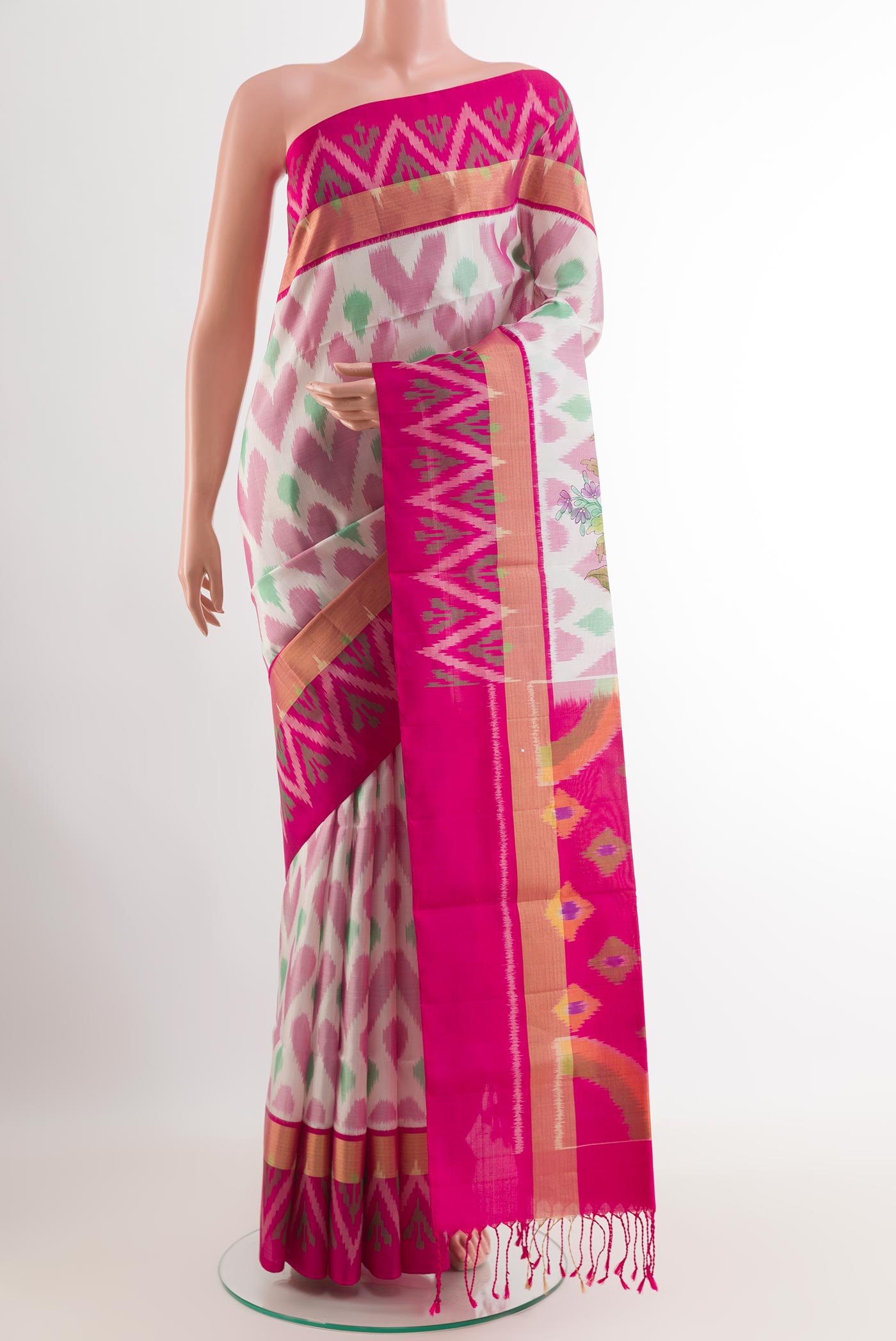 Off White Soft Silk Saree with Pure Ikat on the body and Zari Border.  displayed on a mannequin