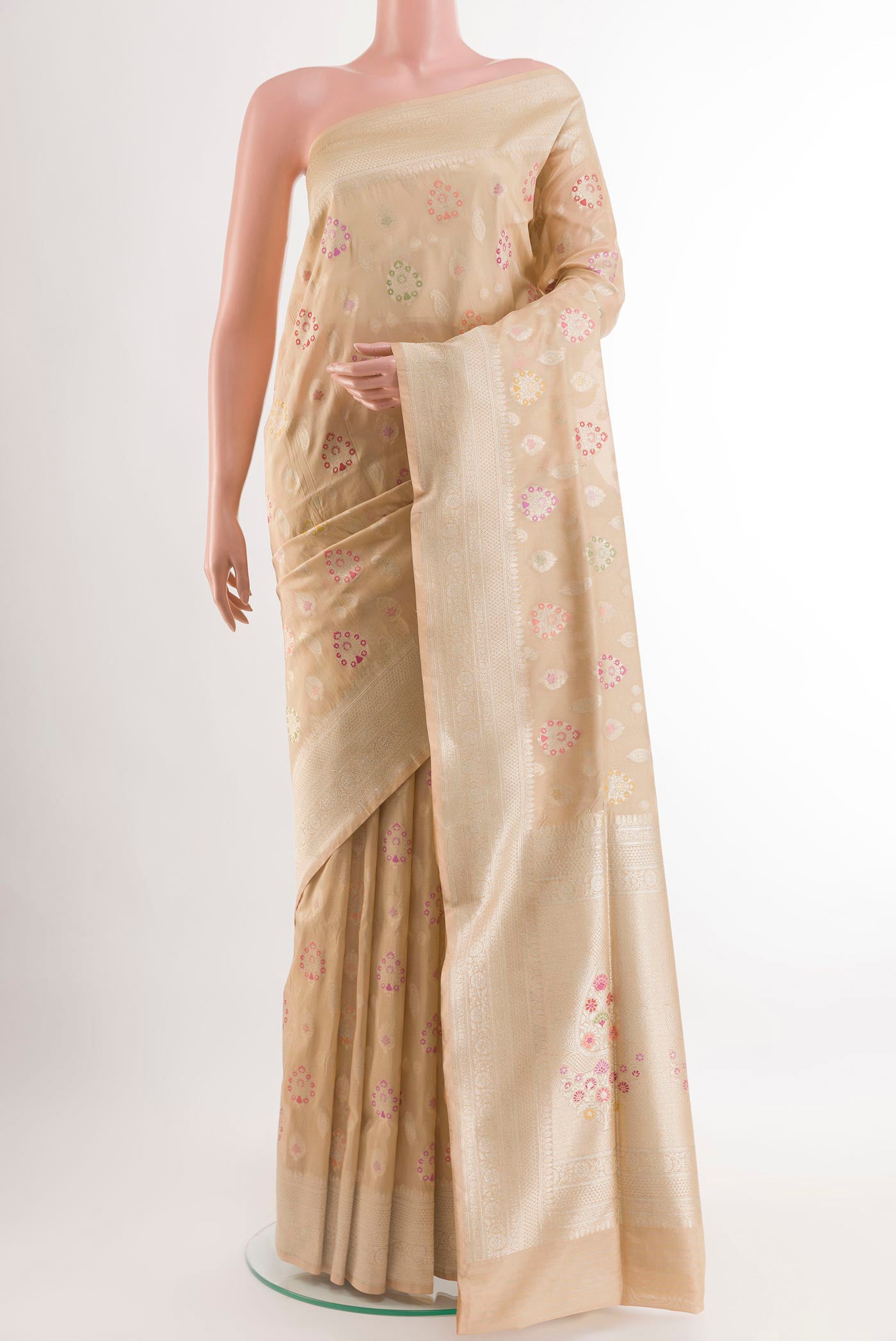 Beige Banarasi Silk Saree with Zari Brocade on the body and Zari Border.  displayed on a mannequin