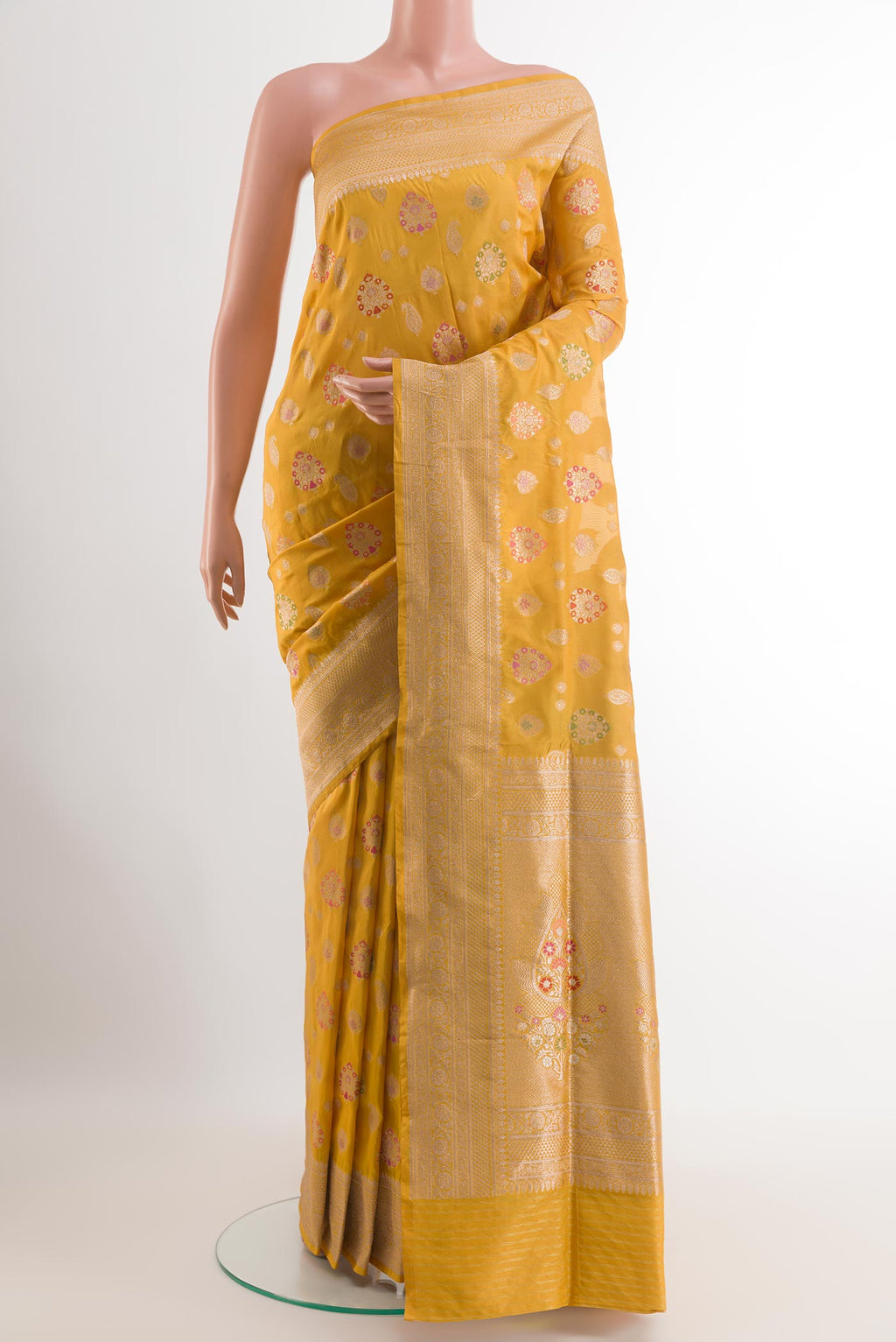 Yellow Banarasi Silk Saree with Zari Butta on the body and Zari Border.  displayed on a mannequin