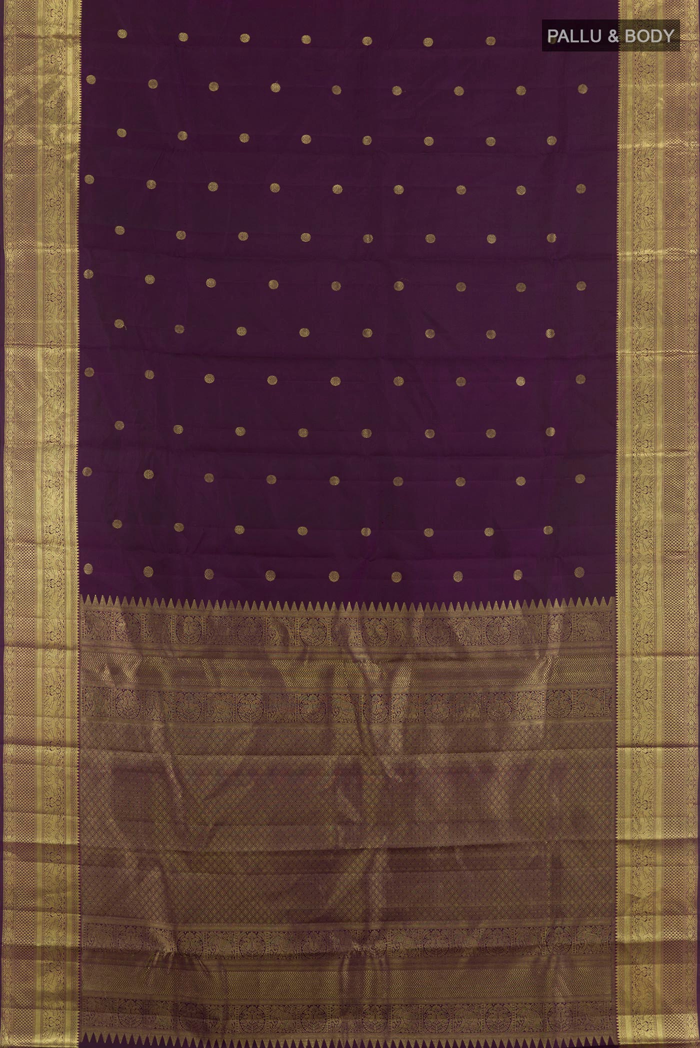 Flat view of Purple Kanchipuram Silk Saree with Zari Butta on the body and Zari Border. 