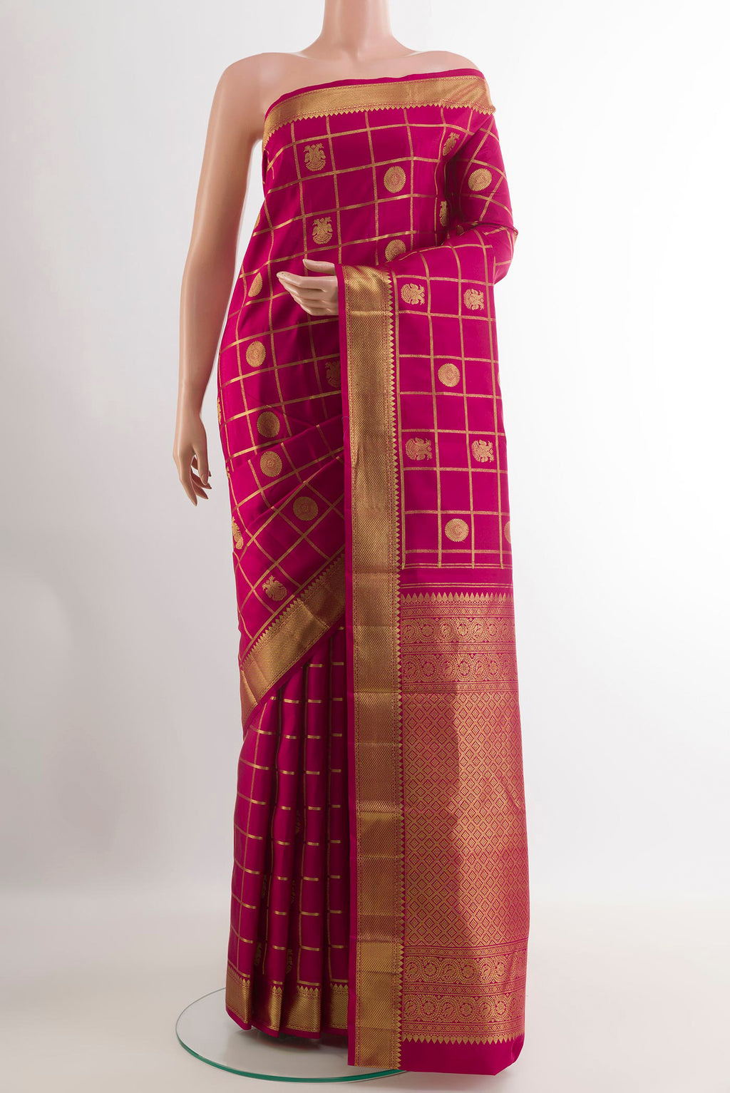 Pink Kanjivaram Silk Saree with Checked design on the body and Zari Border.  displayed on a mannequin