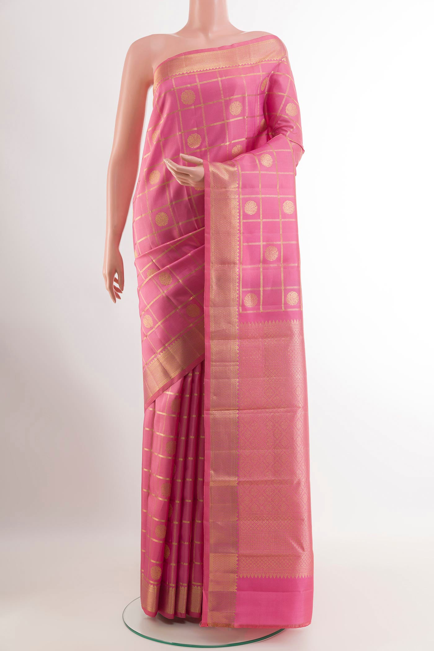Pink Kanjivaram Silk Saree with Zari Butta on the body and Zari Border.  displayed on a mannequin