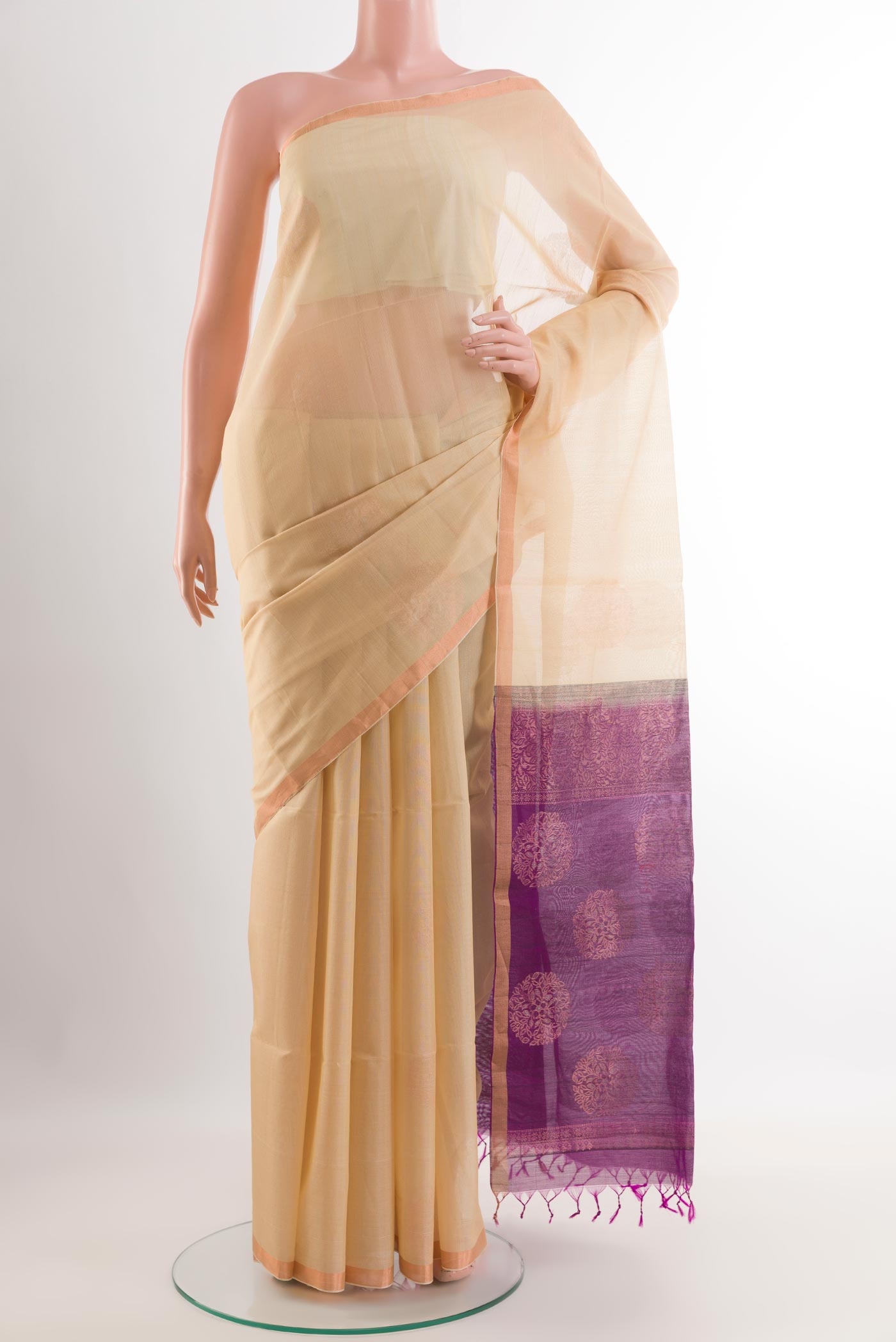 Cream Blended Kora Cotton Saree with Zari Butta on the body and Zari Border.  displayed on a mannequin