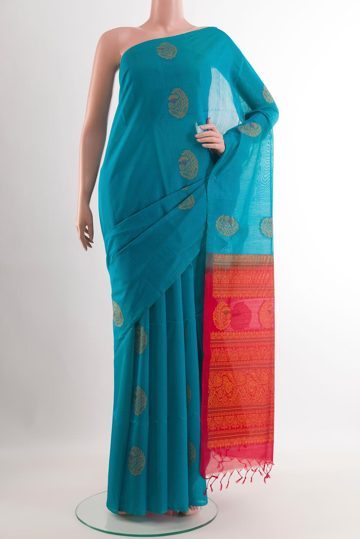 Blue Blended Kora Cotton Saree with Zari Butta on the body and Zari Border.  displayed on a mannequin