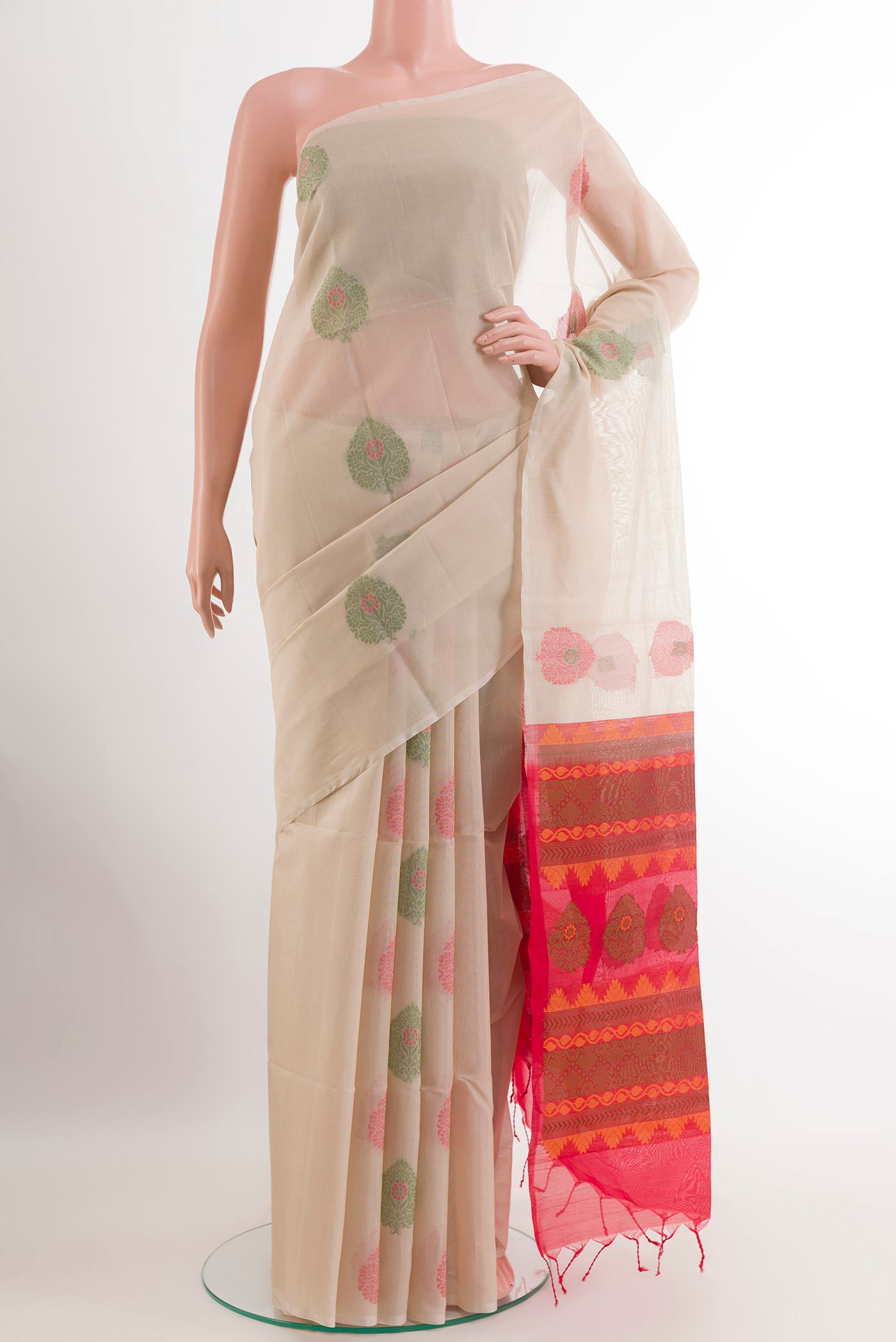 Off White Blended Kora Cotton Saree with Zari Butta on the body and Zari Border.  displayed on a mannequin