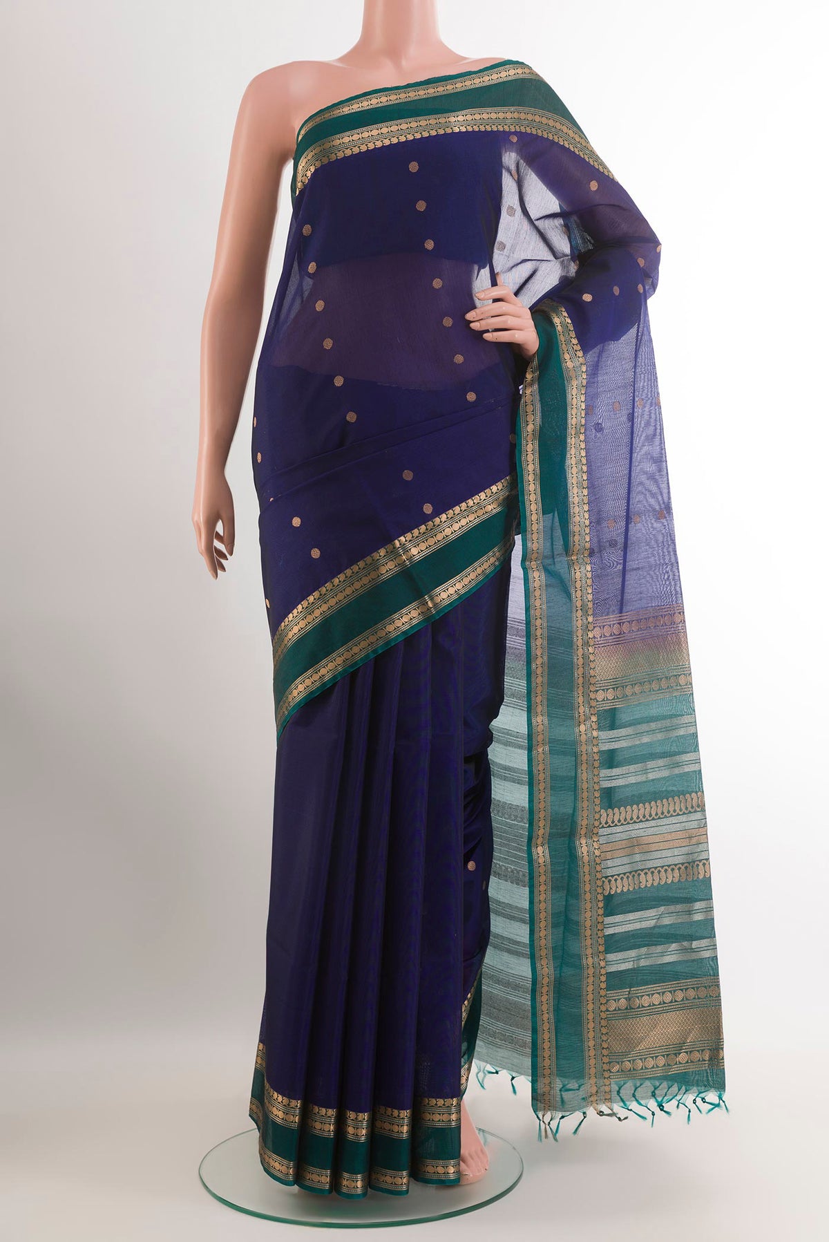 Dark Blue Blended Kora Cotton Saree with Zari Butta on the body and Zari Border.  displayed on a mannequin