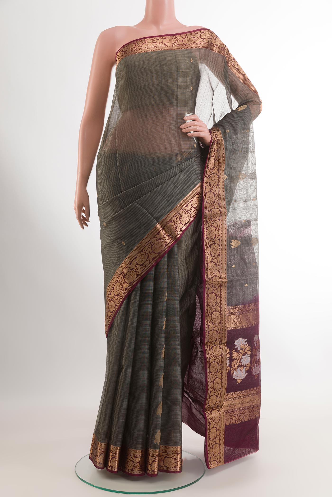 Grey Blended Kora Cotton Saree with Zari Butta on the body and Plain Border.  displayed on a mannequin