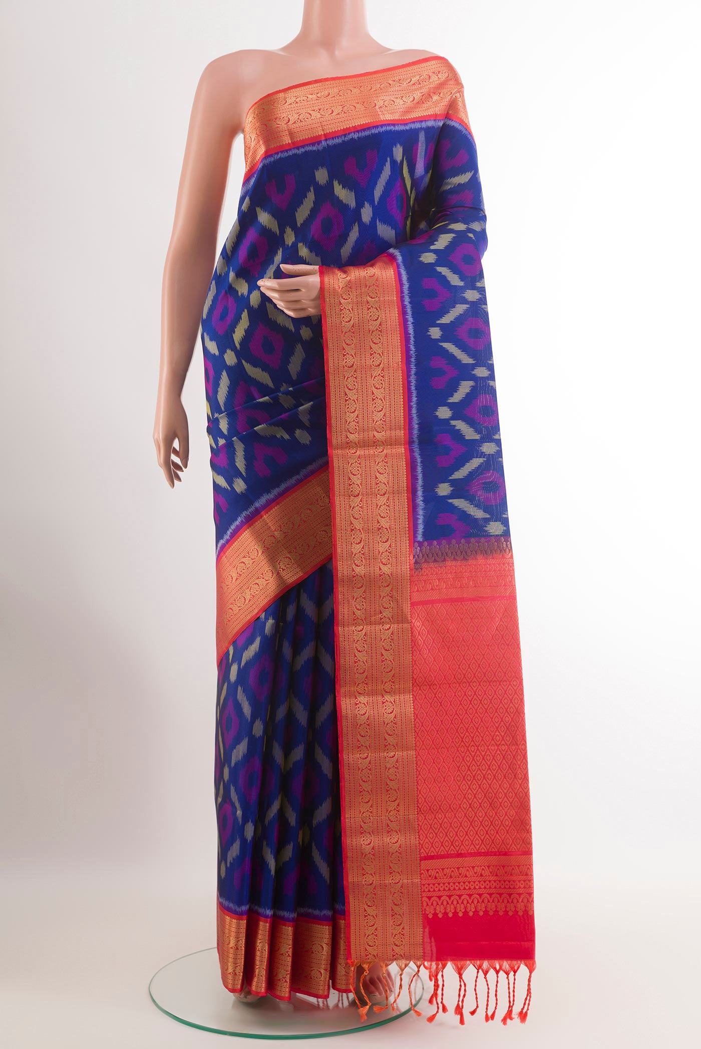 Blue Soft Silk Saree with Ikat design on the body and Zari Border.  displayed on a mannequin