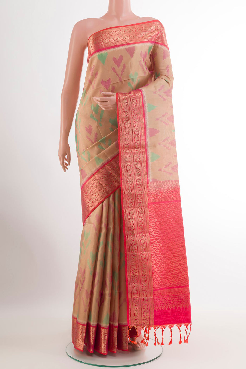 Beige Soft Silk Saree with Ikat design on the body and Zari Border.  displayed on a mannequin