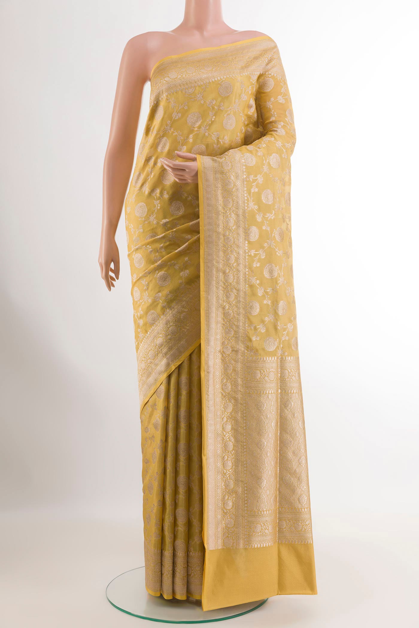 Lemon Yellow Banarasi Silk Saree with Zari Brocade on the body and Zari Border.  displayed on a mannequin