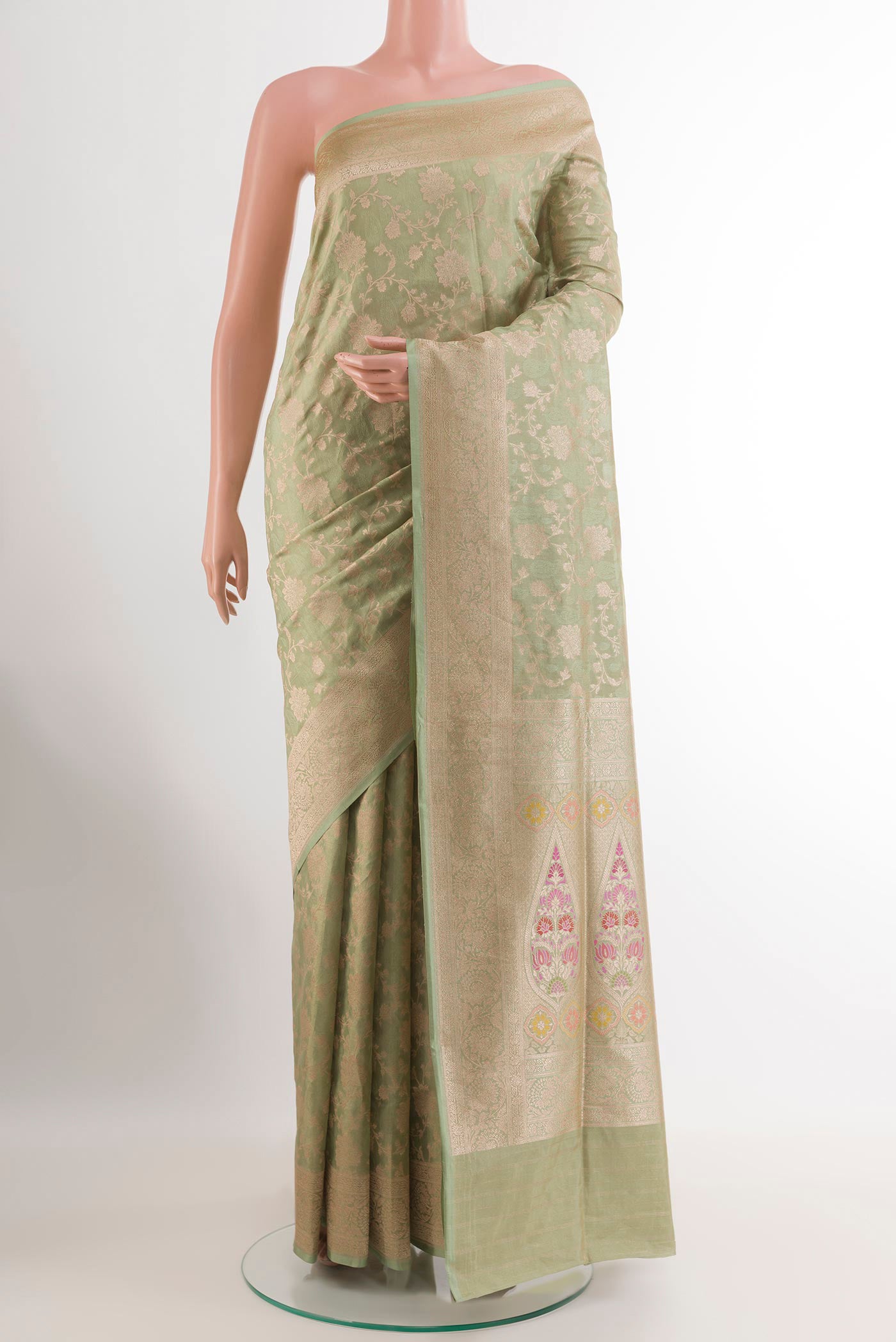 Green Banarasi Silk Saree with Zari Brocade on the body and Zari Border.  displayed on a mannequin
