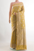Yellow Banarasi Tissue Silk Saree with Zari Brocade on the body and Zari Border.  displayed on a mannequin