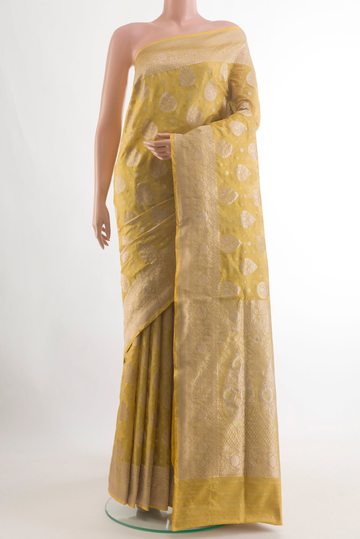 Yellow Banarasi Tissue Silk Saree with Zari Brocade on the body and Zari Border.  displayed on a mannequin