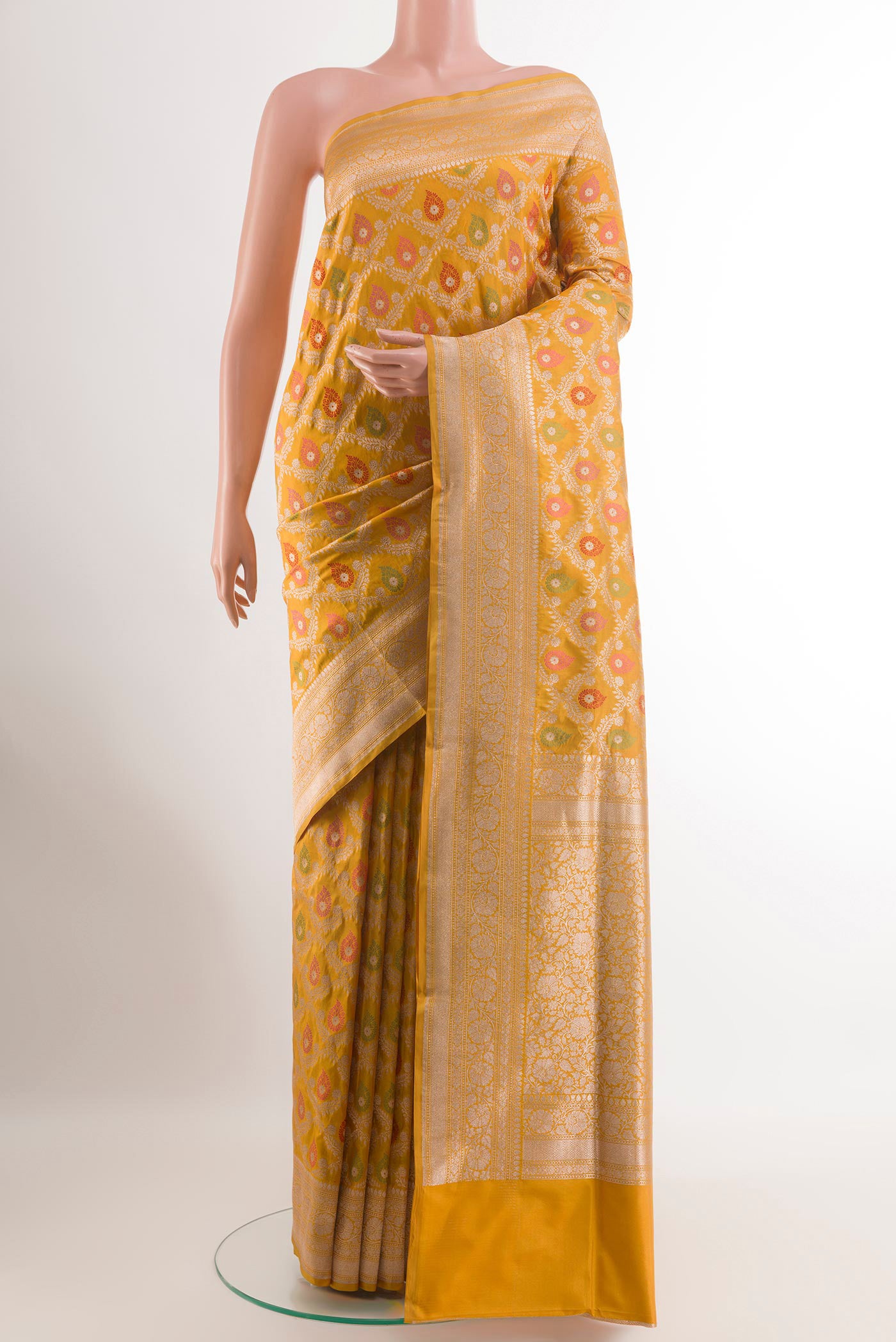 Yellow Banarasi Silk Saree with Zari Brocade on the body and Zari Border.  displayed on a mannequin