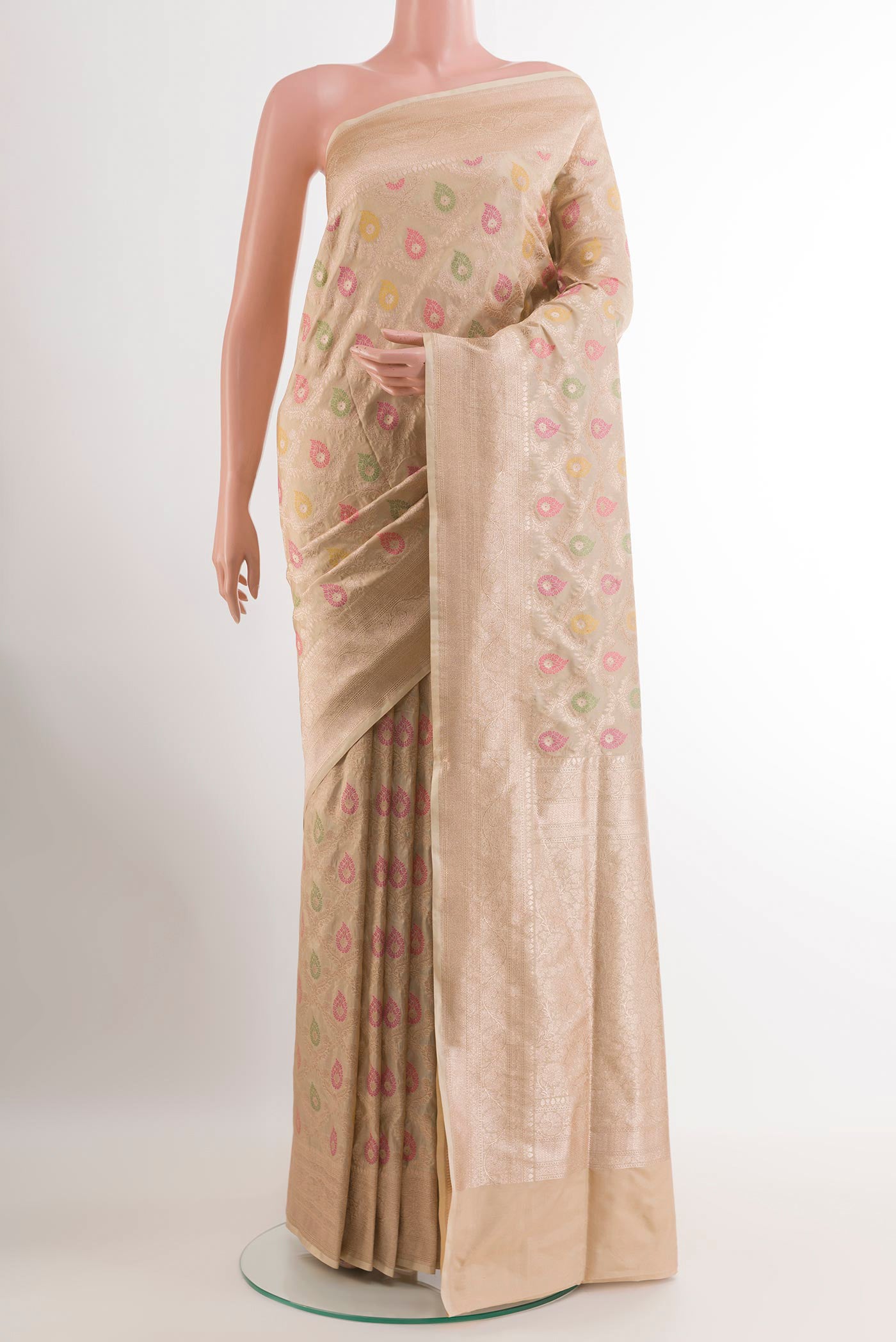 Beige Banarasi Silk Saree with Zari Brocade on the body and Zari Border.  displayed on a mannequin