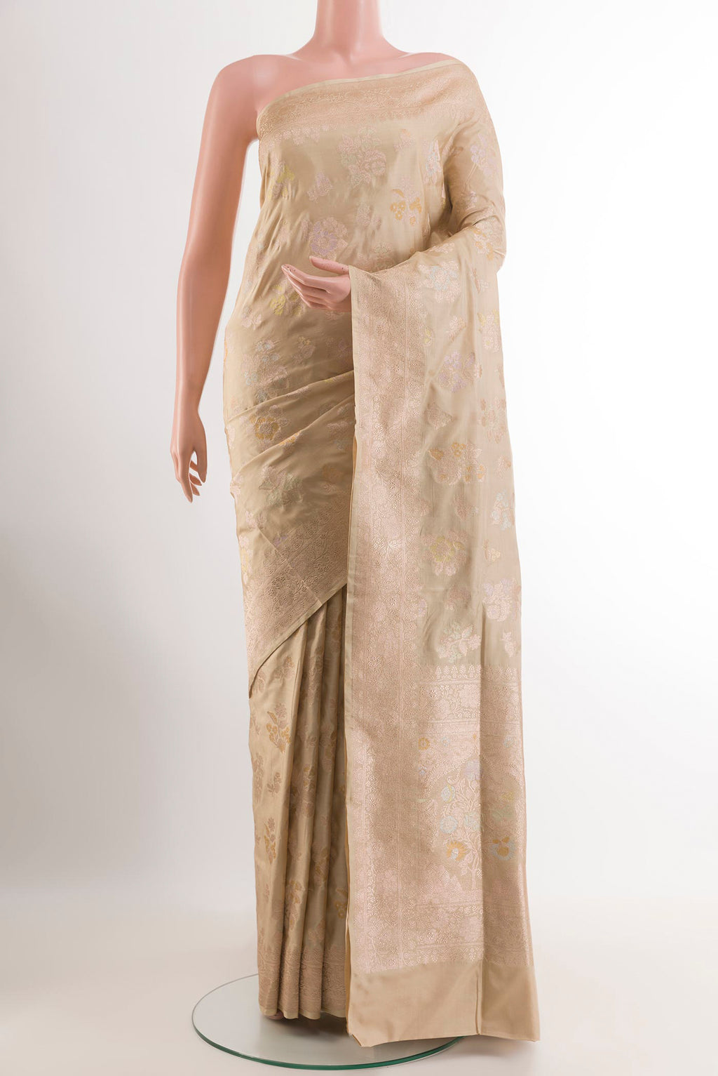 Cream Banarasi Silk Saree with Zari Brocade on the body and Zari Border.  displayed on a mannequin